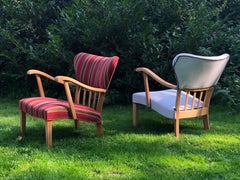 A pair of curved armchairs in solid oak from the 1940s.