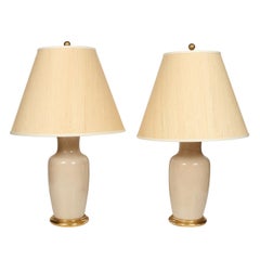 Pair of Custom Cream Porcelain Lamps with Gilt Bases