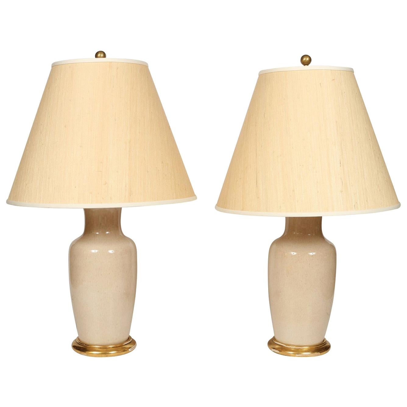 Pair of Custom Cream Porcelain Lamps with Gilt Bases
