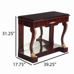 A Pair of custom Empire style crotch mahogany console tables.