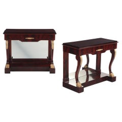A Pair of custom Empire style crotch mahogany console tables.