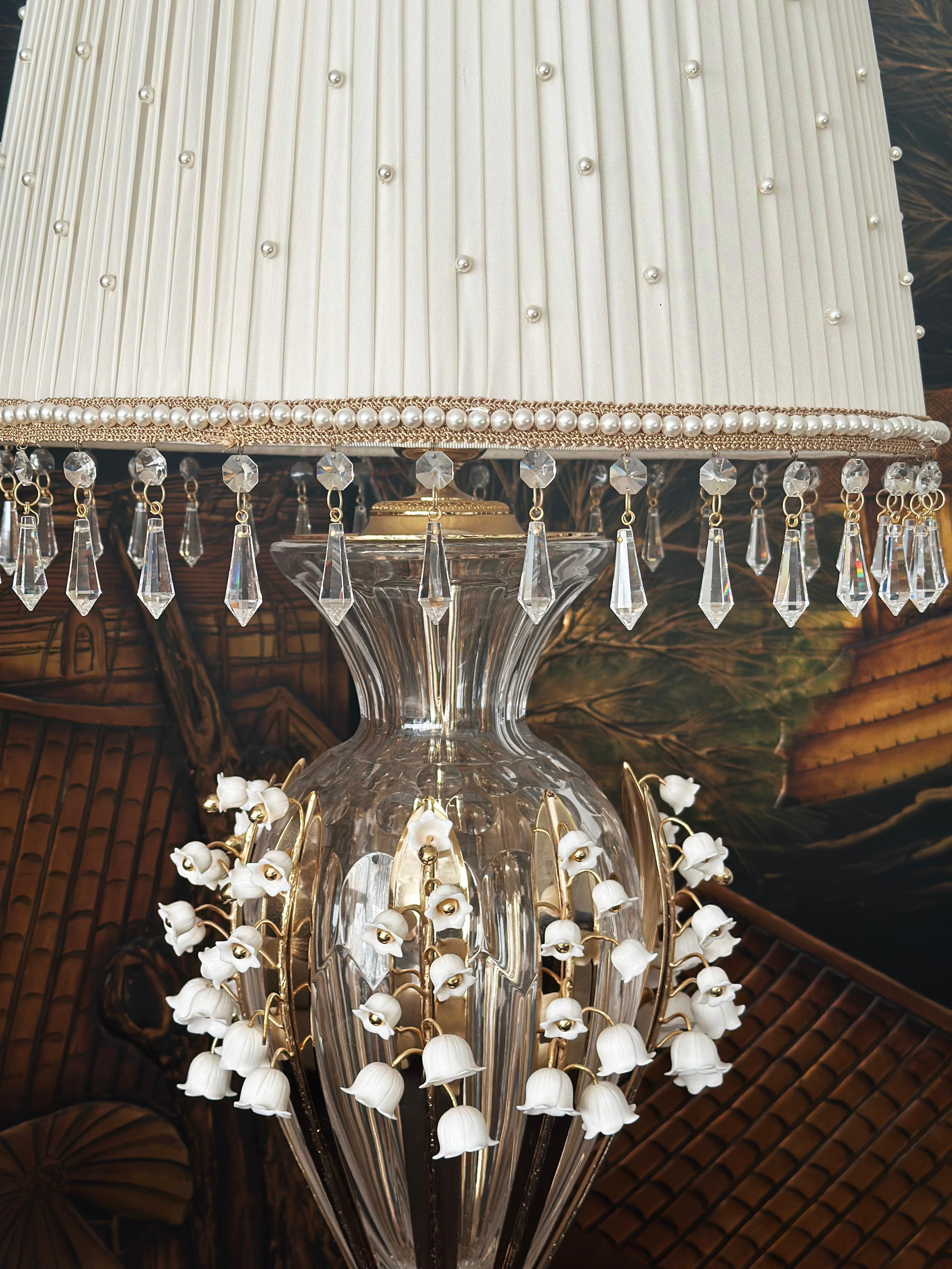  Pair of Custom Made Neoclassical Revival  Crystal and Porcelain Table Lamps 
Introducing the stunning Lilies of the Valley table lamp from the famous Alexander's Collection. This exquisite lamp features a base of engraved crystal, giving it a