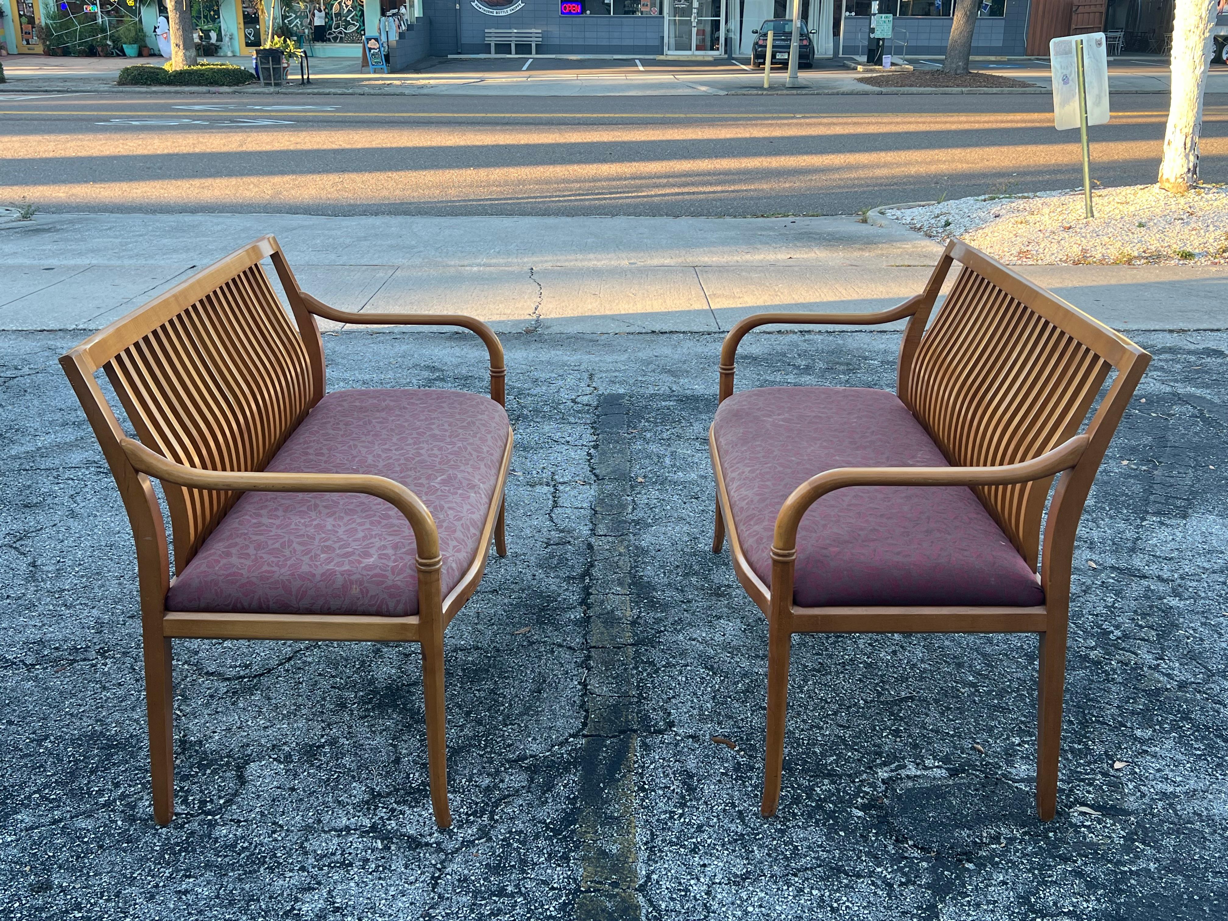A charming pair of custom settees by Paoli, Indiana, made ca' 1980's. Sculptural style enhanced by the warmth of maple. Original upholstery.