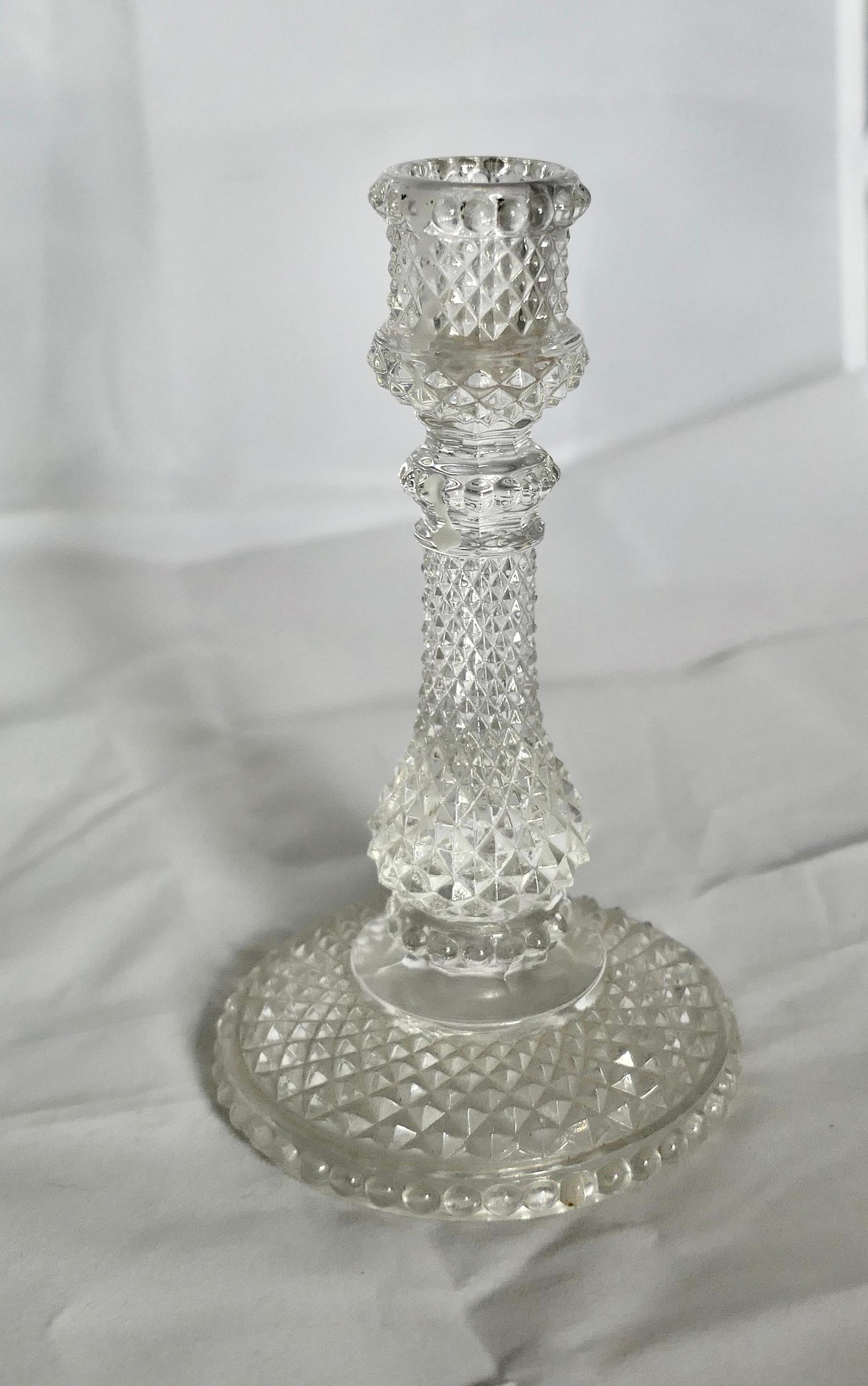 A Pair of Dainty Baccarat Crystal Zenith Candlesticks

A Lovely Pair of Table Candle Sticks, with a intensive Diamond faceted design to maximise the refraction of the light, very beautiful and not too large a size ideal for intimate dining 

These