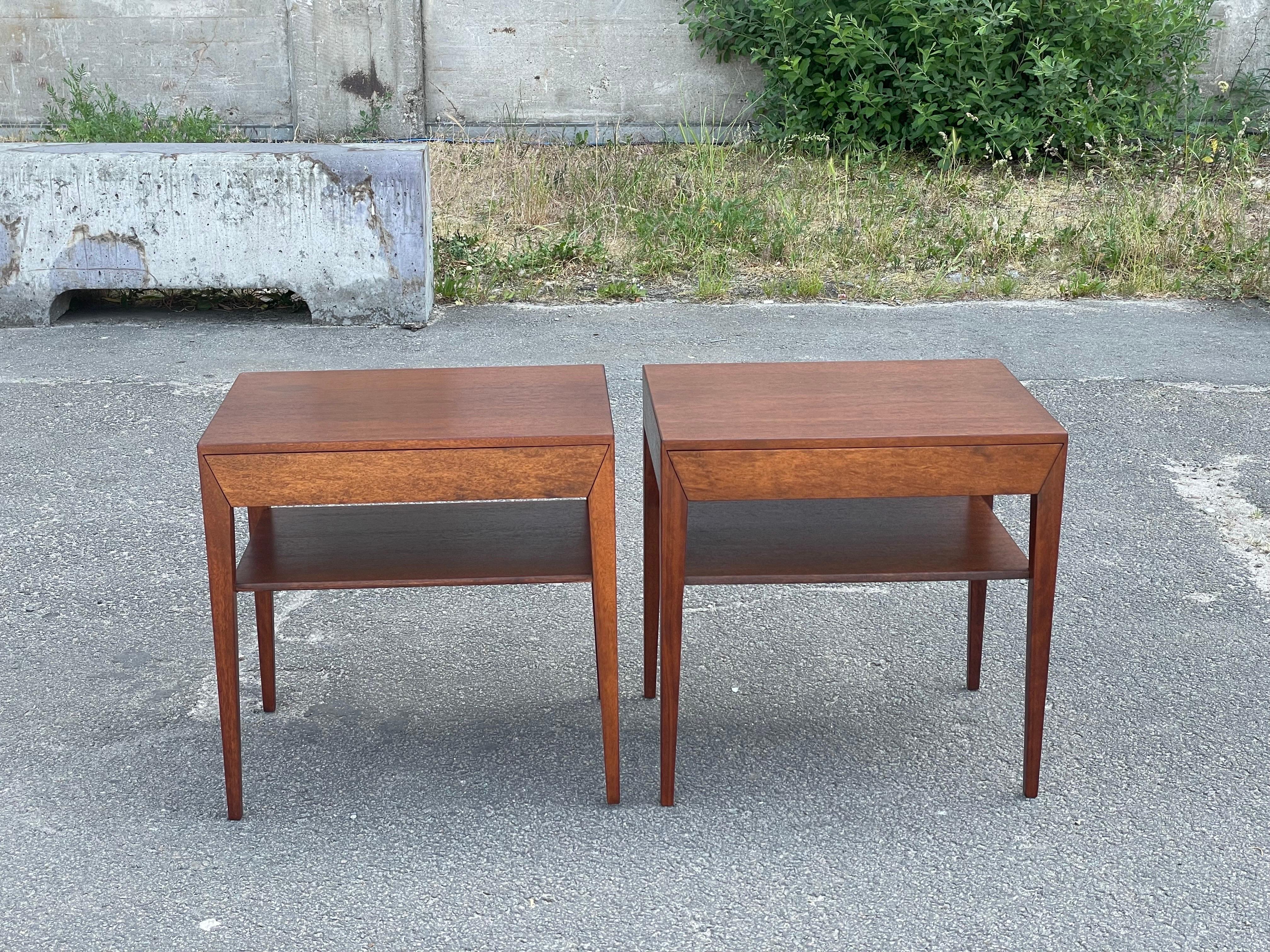 A remarkable find for lovers of mid-century modern design: a stunning pair of nightstands designed by Severin Hansen for Haslev Furniture of Denmark in the 1960s. These nightstands are a testament to timeless elegance and functional beauty. Crafted