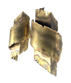 A pair of Danish 1960s Holm Sorensen torch cut brass wall sconces