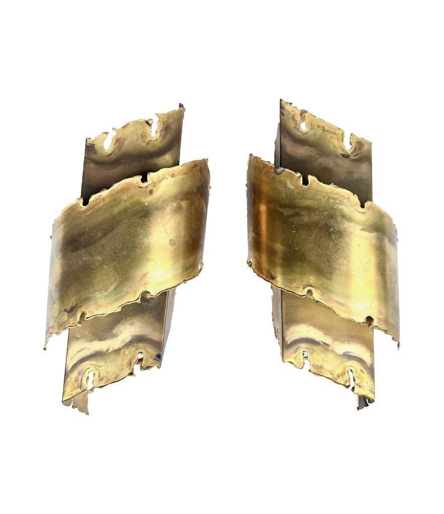 Mid-Century Modern A pair of Danish 1960s Holm Sorensen torch cut brass wall sconces For Sale