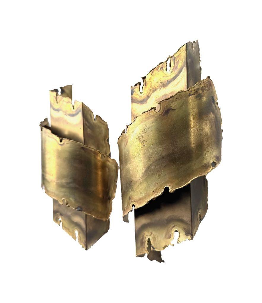 Brass A pair of Danish 1960s Holm Sorensen torch cut brass wall sconces For Sale
