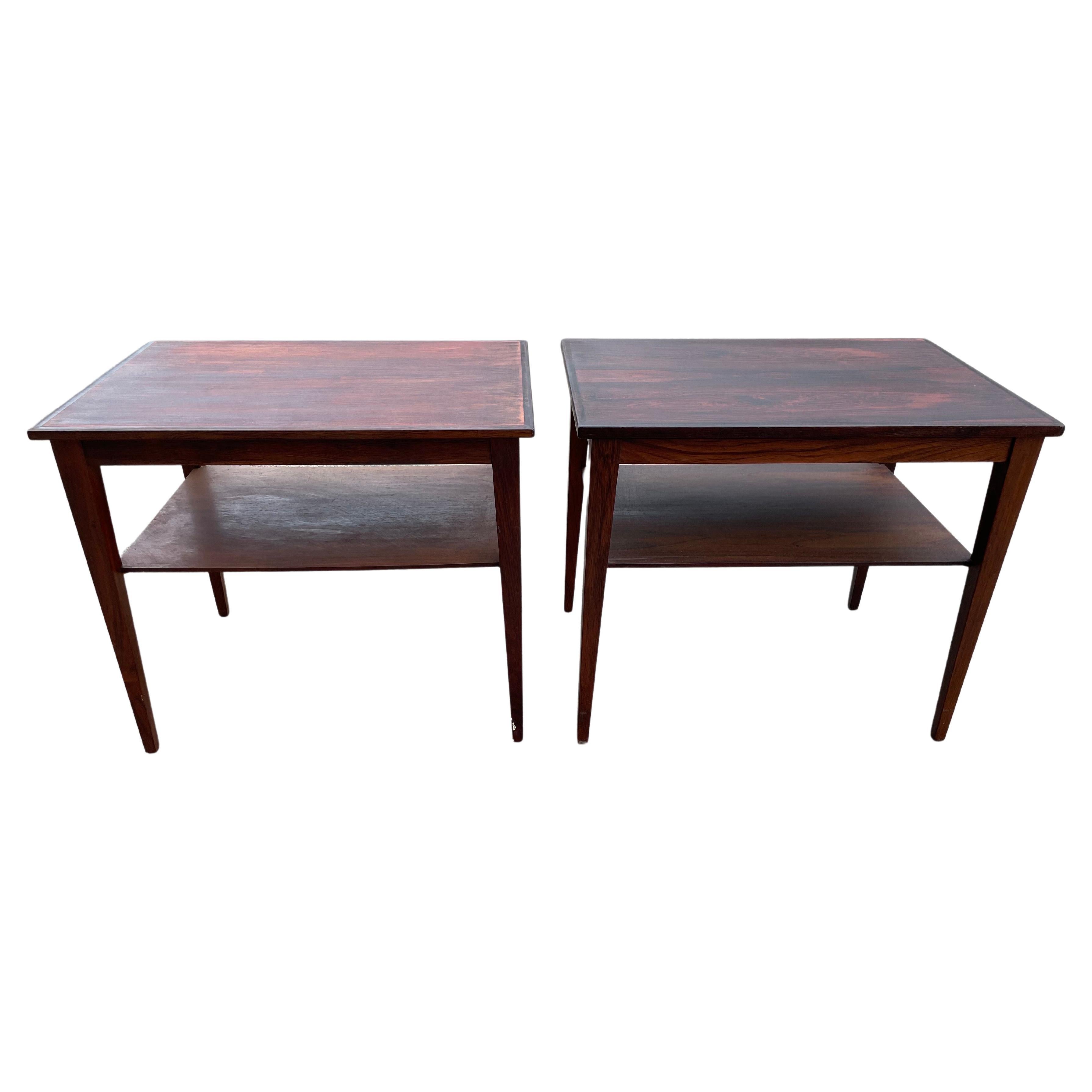 A pair of exquisite rosewood side tables from the 1960s. These versatile pieces effortlessly combine style and functionality, making them ideal as nightstands or standalone accent tables. Crafted with meticulous attention to detail, the rich