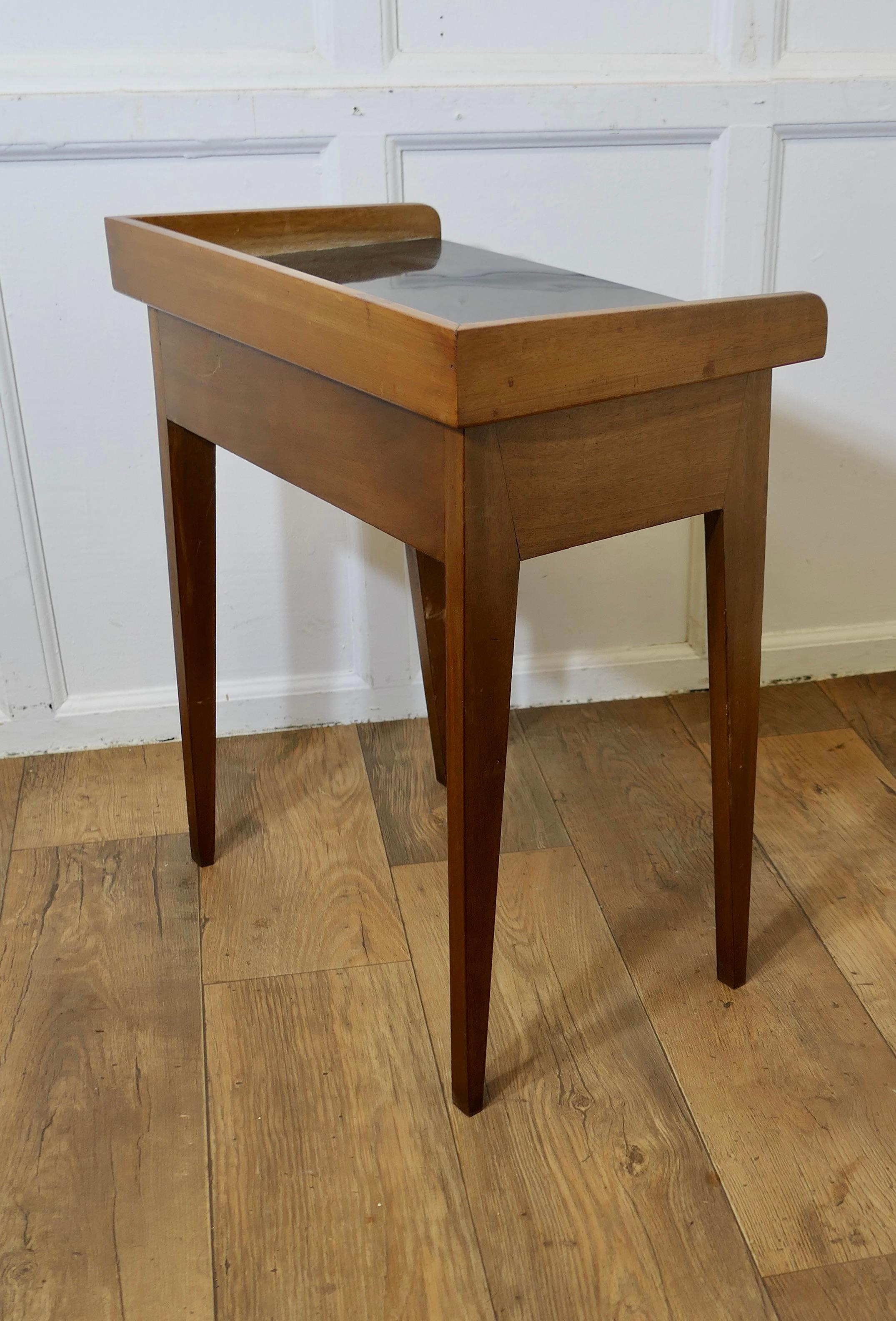 A Pair of Danish Mid Century Tray Top Tables, Bedside, Fireside Tables

A stylish pair of Teak Side tables with removable tray tops
The tables are made in Teak and the trays are in black melamine for easy cleaning, the tables have an under-tier so