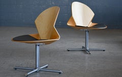 A Pair of Danish Modern Lounge Chairs in Bent Maple and Black Leather Seat