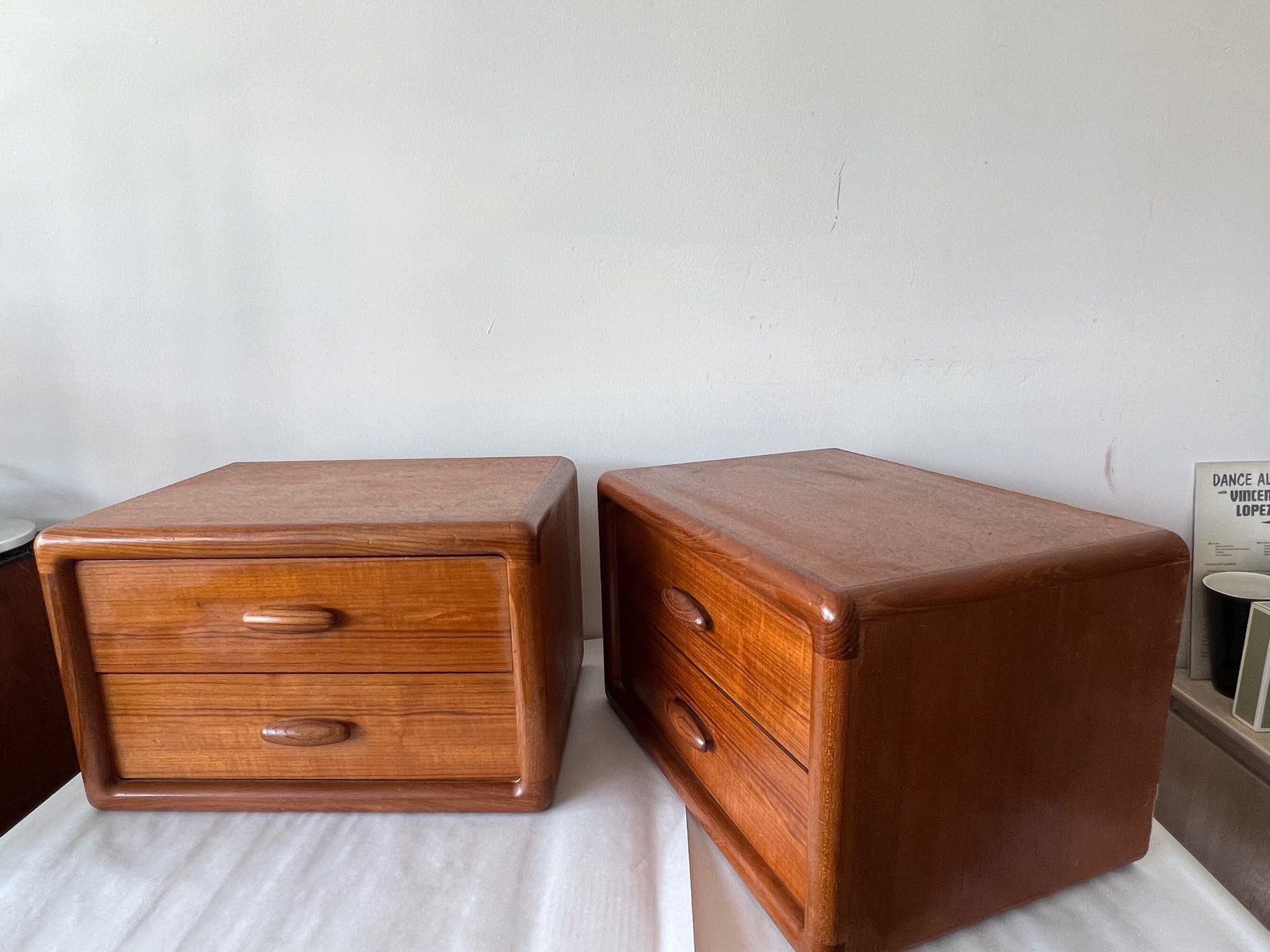 A pair of Danish modern drawers by Dyrlund, circa 1970s. No legs-these are small drawers, that can be stacked or used separately. Sculptural, solid teak handles.