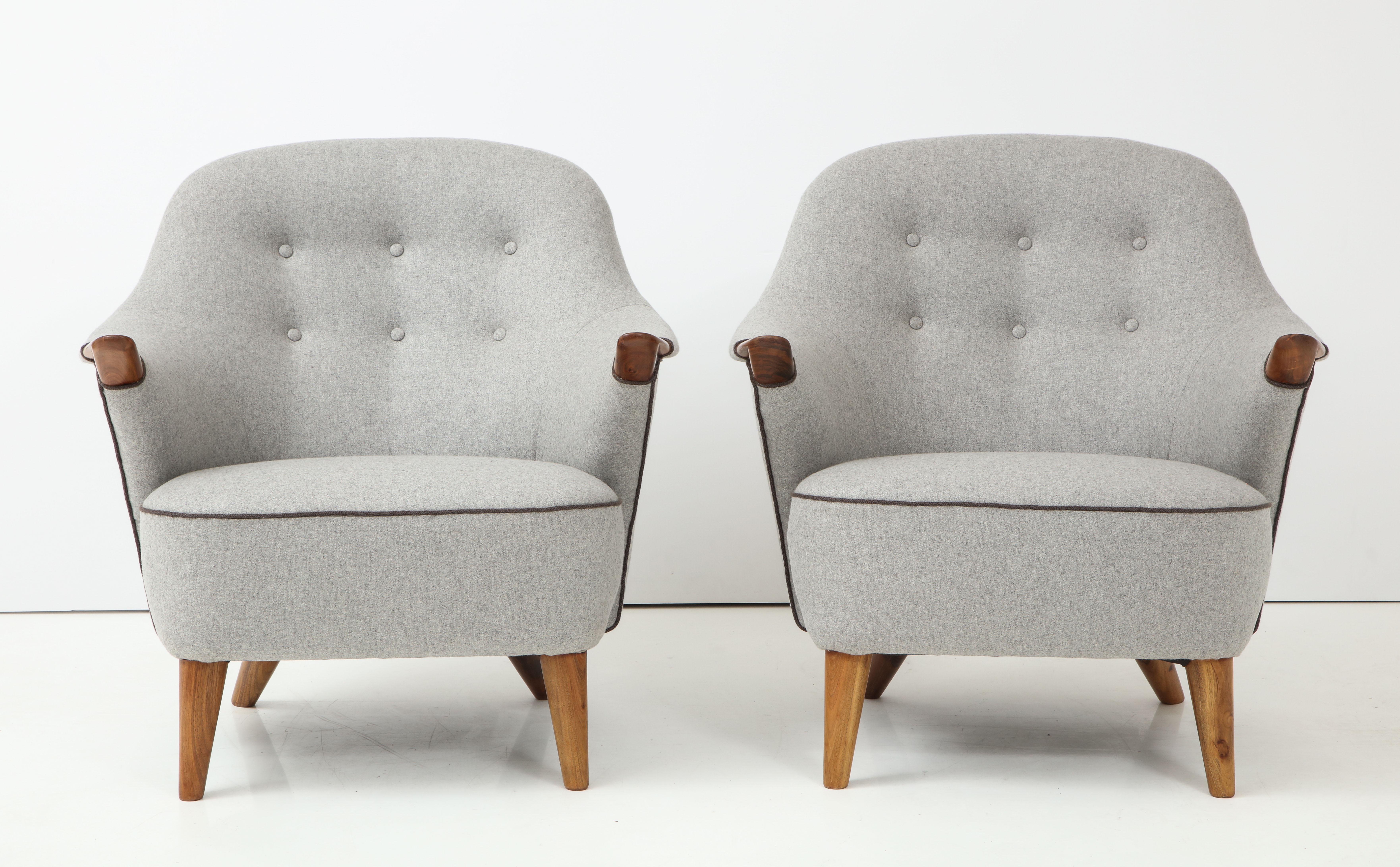 A pair of Danish tub-back lounge chairs by Arne Hovmand -Olsen, circa 1960s. Walnut with new two-tone wool upholstery. Great looking and really comfortable.