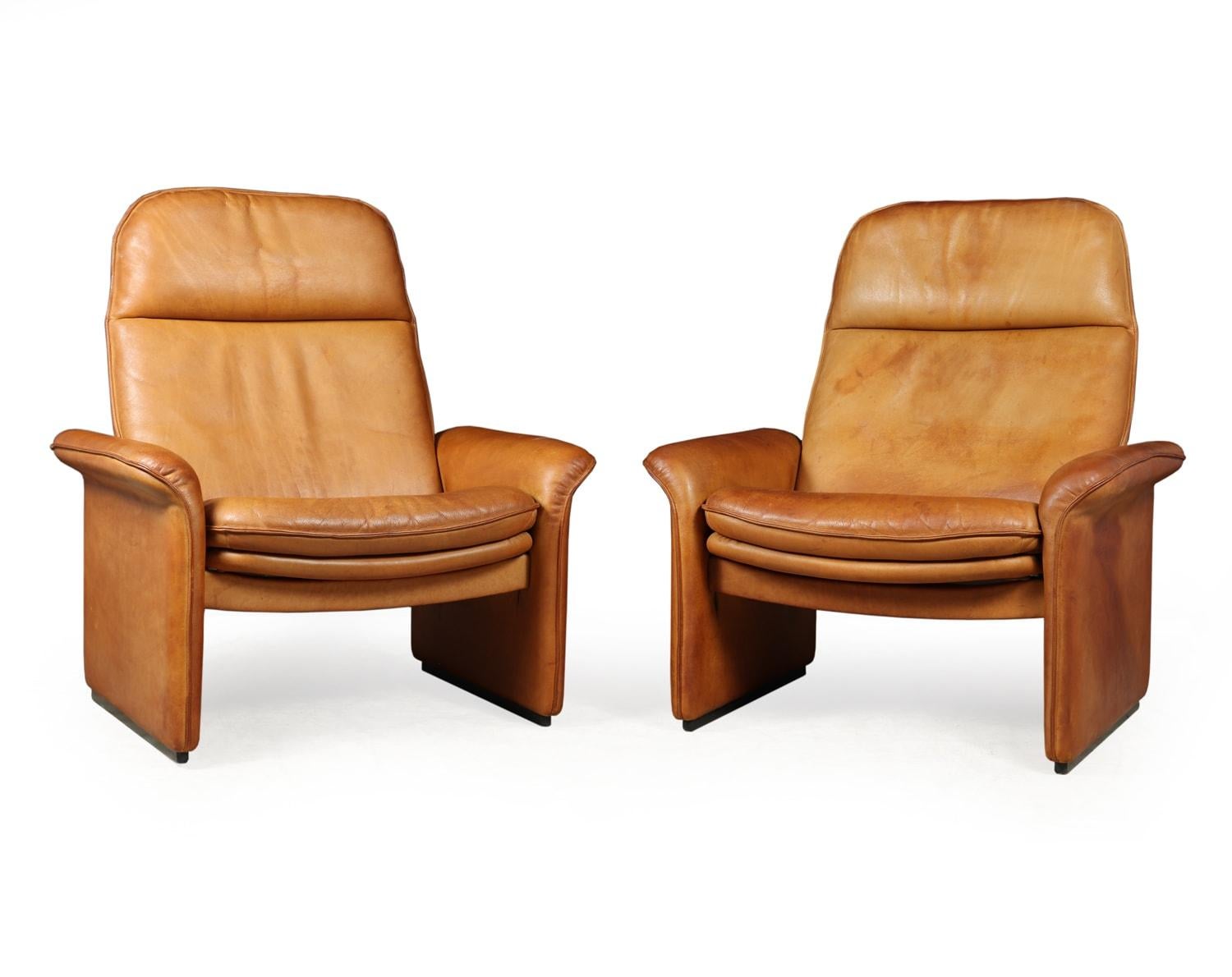 A pair of De Sede Reclining DS50 in Tan Neck leather

A pair of relining chairs from the exclusive range of De Sede. Produced in the Switzerland in the 1960’s these chairs remain in great original condition. They have a thick neck leather in a tan