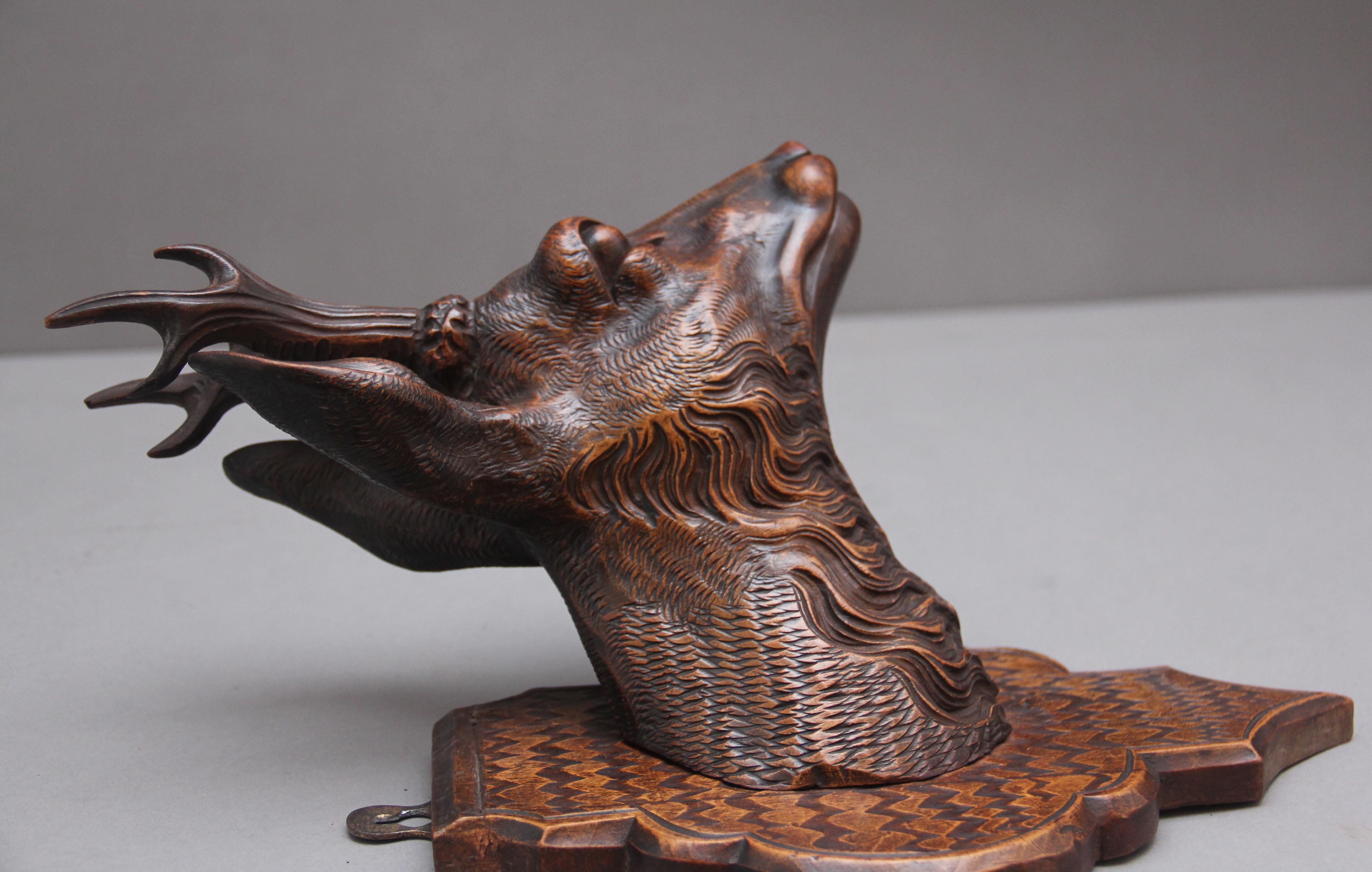 A pair of decorative 19th Century carved walnut black forest deer heads 3
