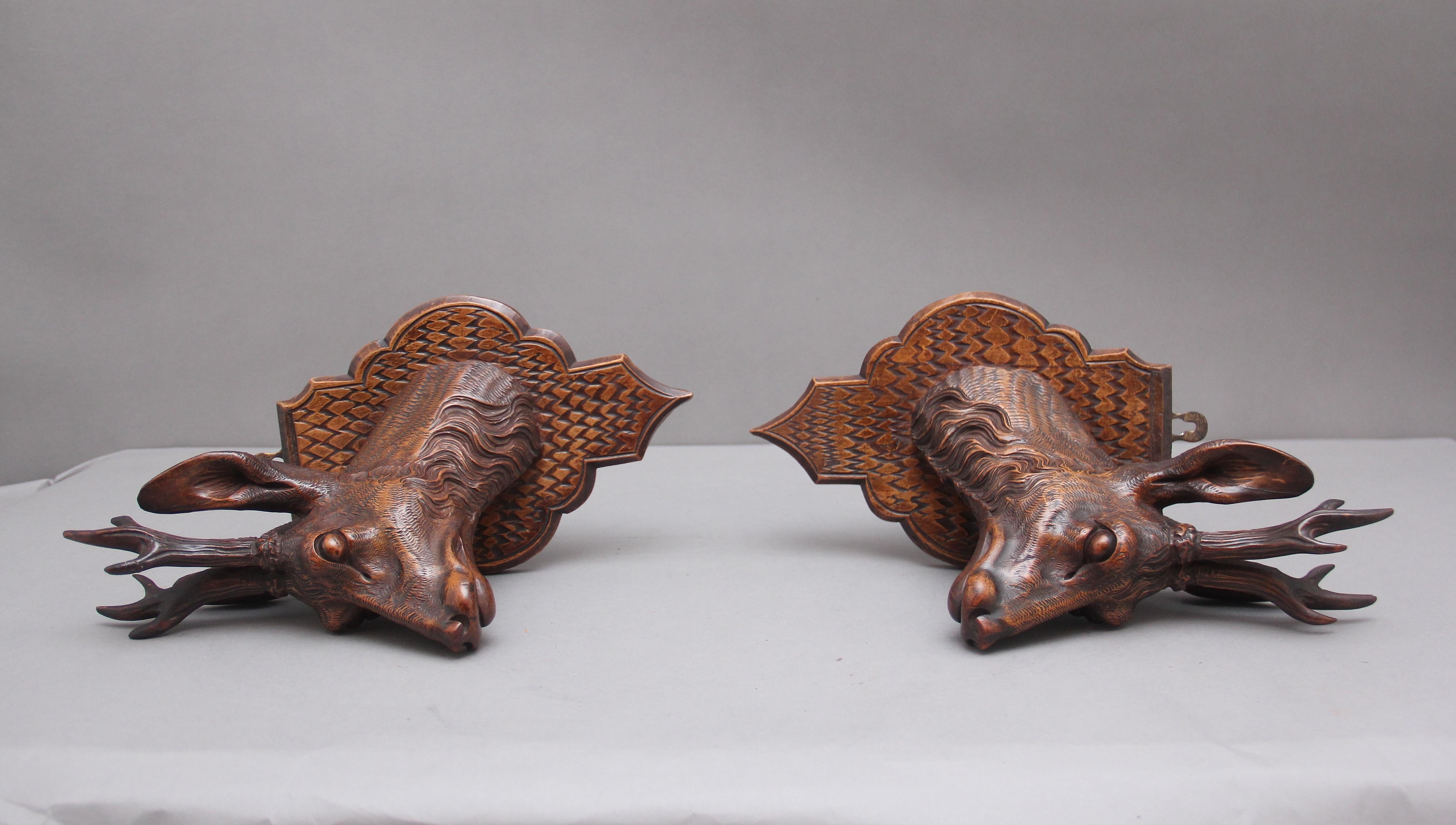 A pair of decorative 19th Century carved walnut black forest deer heads 4