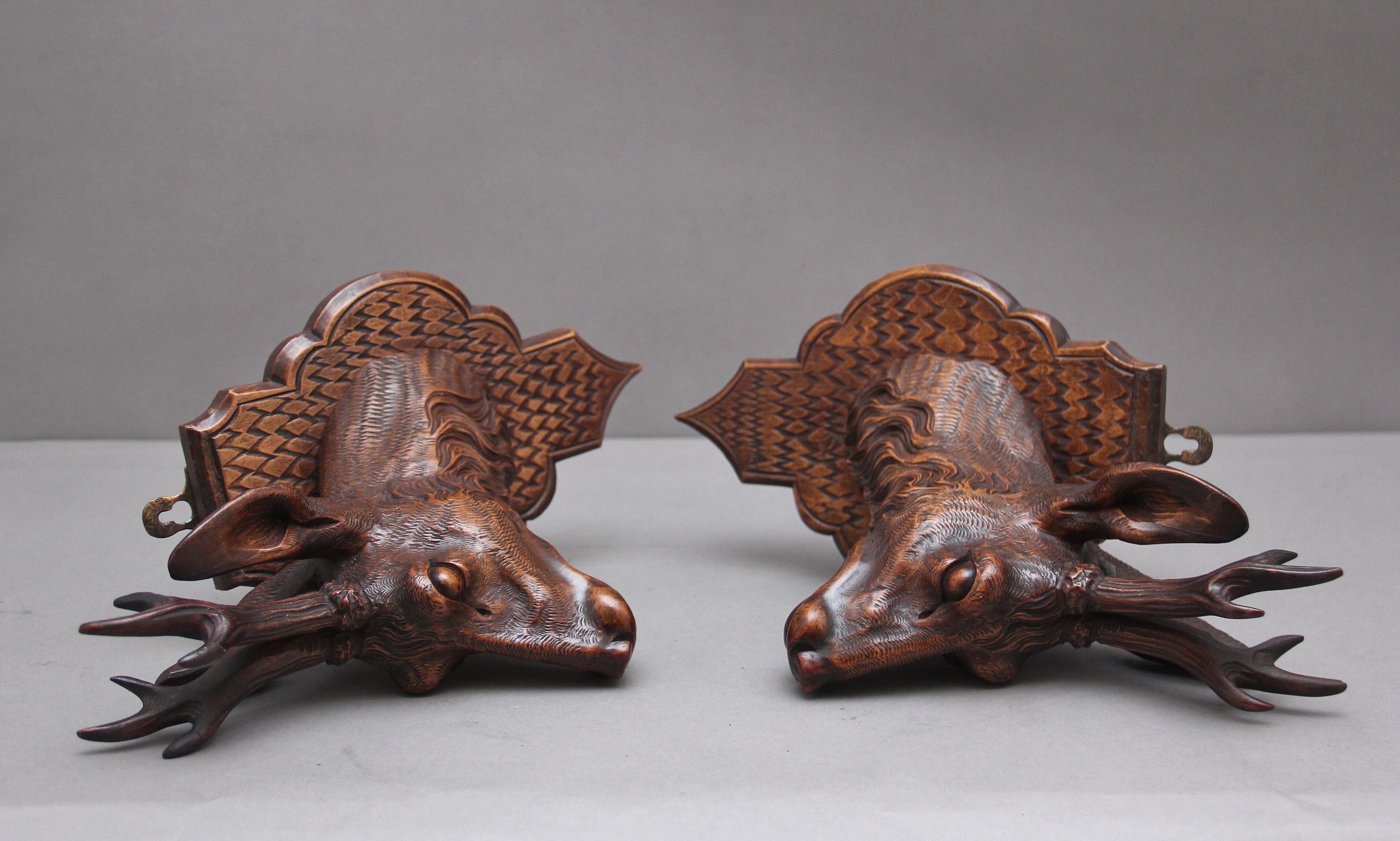A pair of decorative 19th Century carved walnut black forest deer heads 5