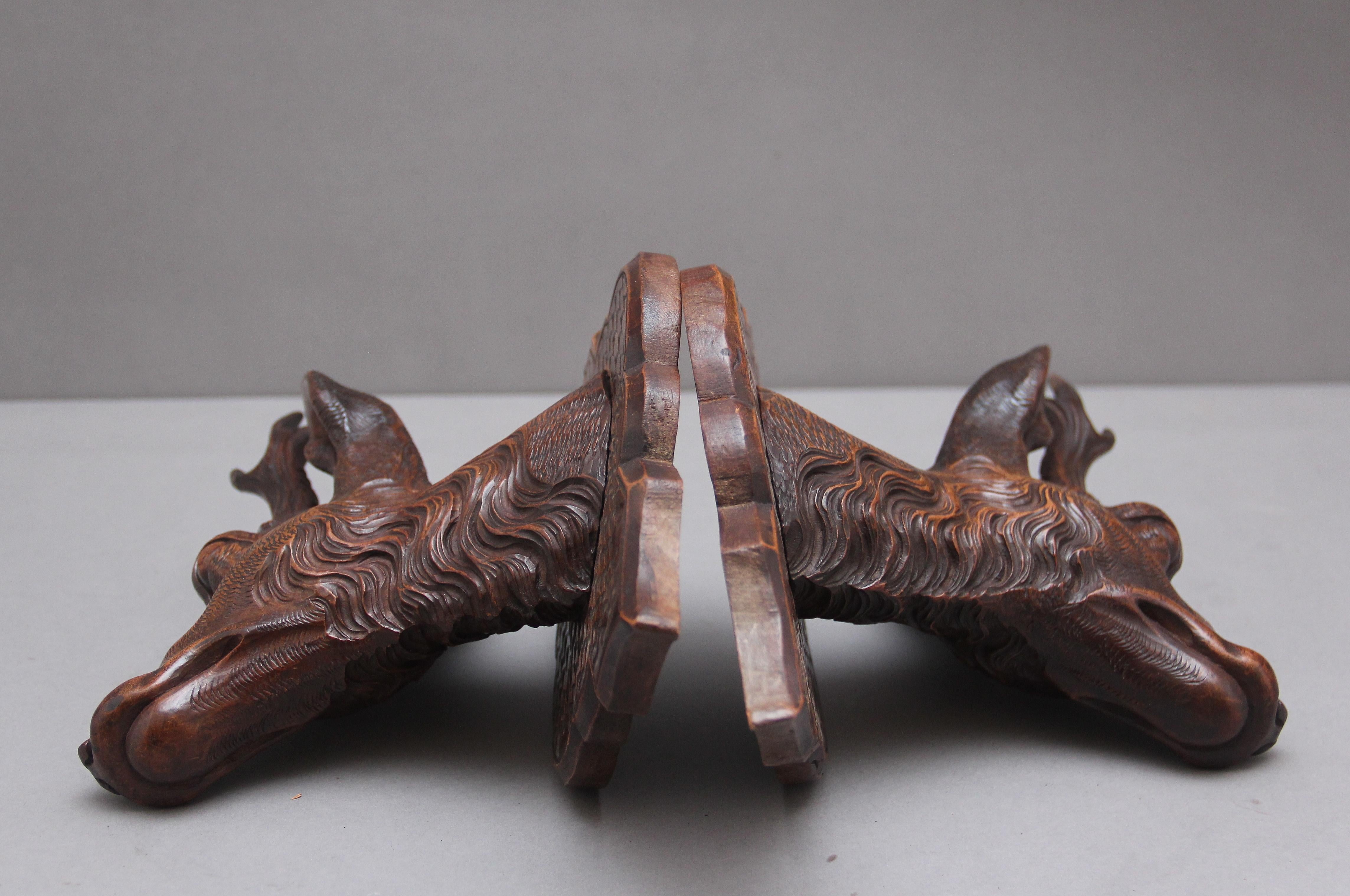 A pair of decorative 19th Century carved walnut black forest deer heads 7