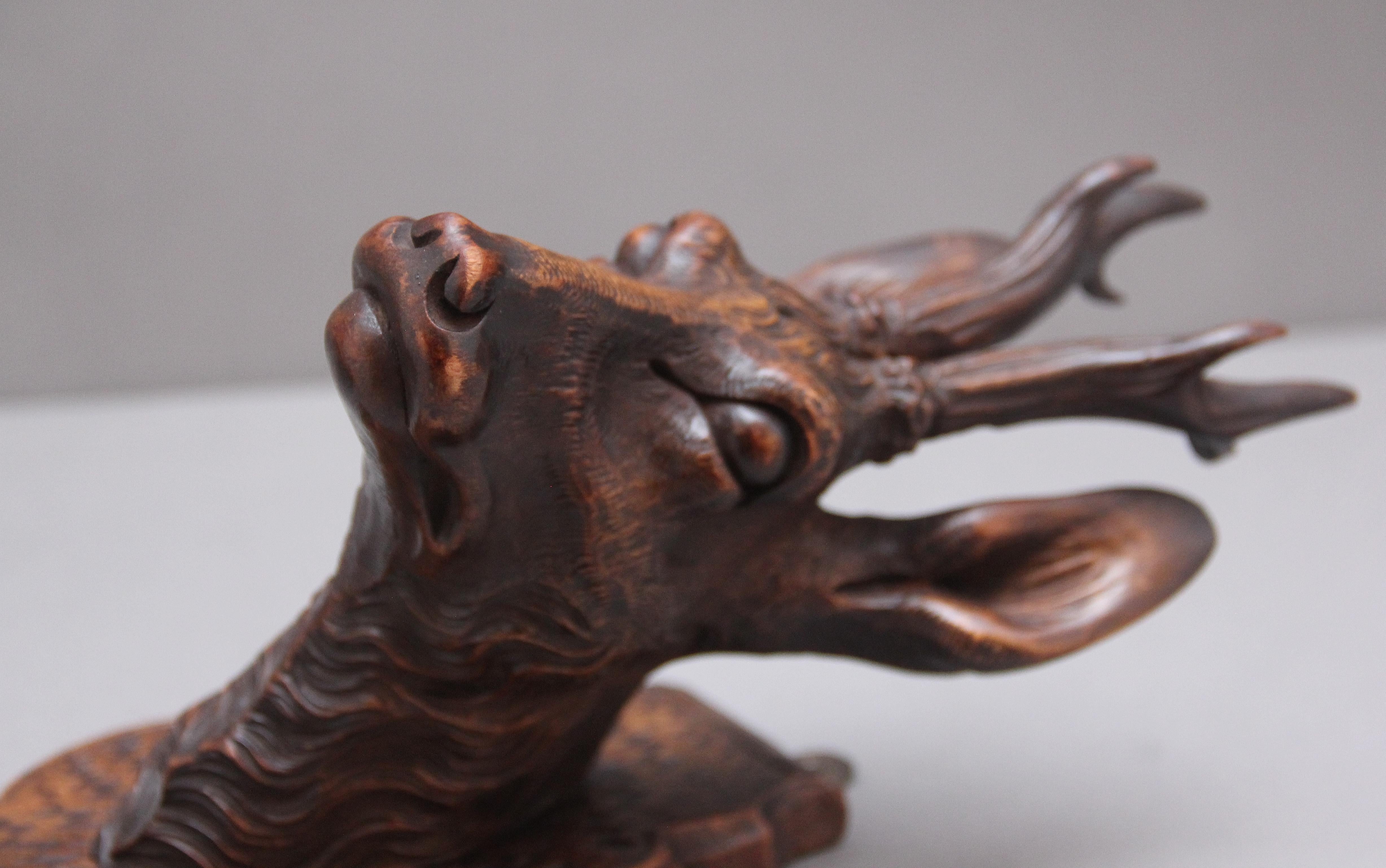 A pair of decorative 19th Century carved walnut black forest deer heads 2