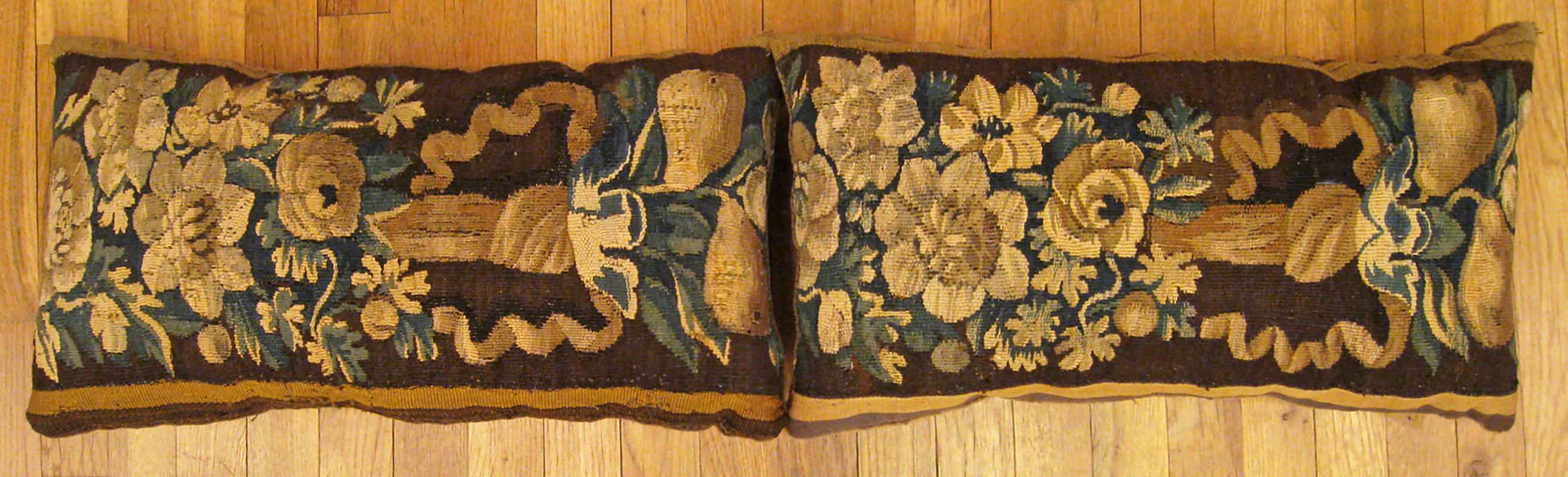 A Pair of Antique 18th Century Tapestry Pillows ; size 1'0” x 1'10” Each.

An antique decorative pillows with floral elements allover a brown central field, size 1'0” x 1'10” each. This lovely decorative pillow features an antique fabric of a 18th