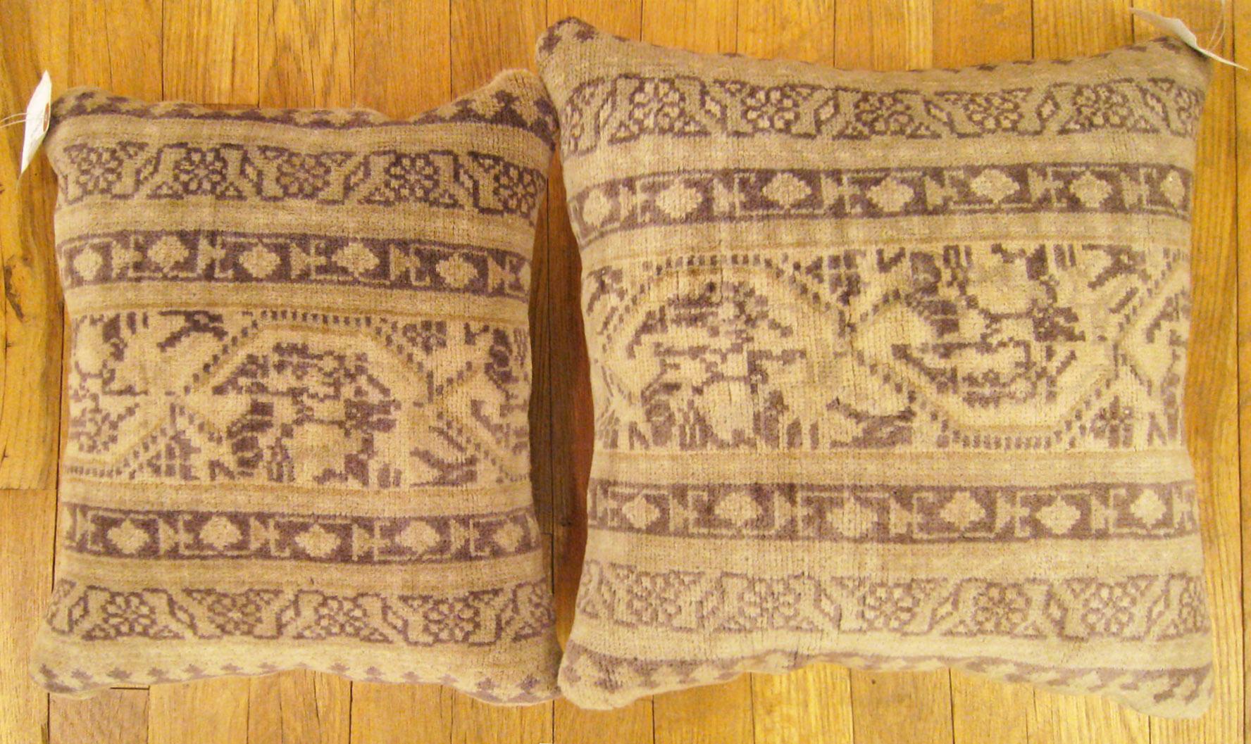 A pair of antique Indian Agra carpet pillows ; Size 1'2” x 1'0” and 1'3” x 1'3”.

An antique decorative pillows with geometric abstracts allover a cream central field, size 1'2” x 1'0” and 1'3” x 1'3”. This lovely decorative pillow features an