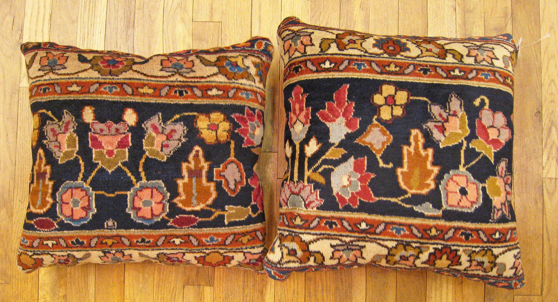 A pair of antique indian agra rug pillows ; size 1'5” x 1'5” and 1'6” x 1'6”

An antique decorative pillows with floral elements allover a blue central field, size  1'5” x 1'5” and 1'6” x 1'6” each. This lovely decorative pillow features an antique