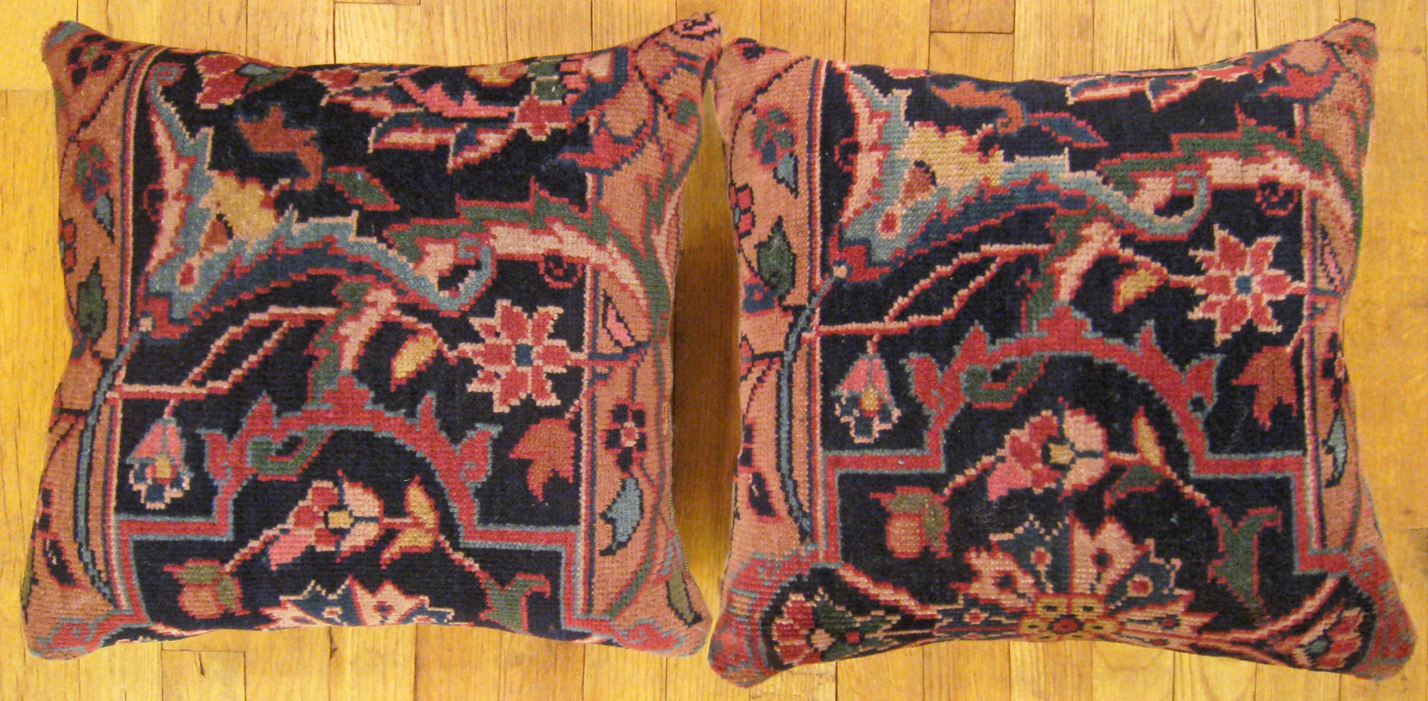 A Pair of Antique Indian Agra rug pillows ; size 1'6” x 1'4” Each.

An antique decorative pillows with floral elements allover a coral central field, size 1'6” x 1'4” each. This lovely decorative pillow features an antique fabric of a Agra rug on