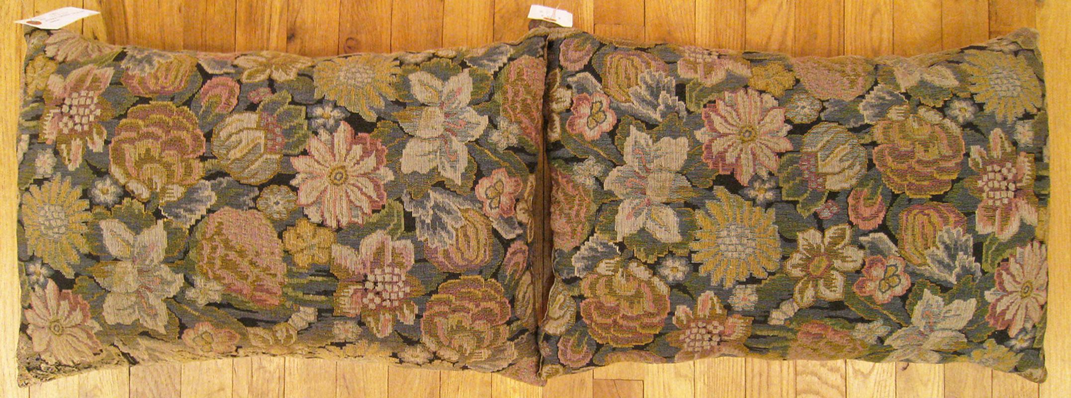 A pair of antique Jacquard Tapestry pillows ; size 1'3” x 1'11” Each.

An antique decorative pillows with floral elements allover a gold green central field, size 1'3