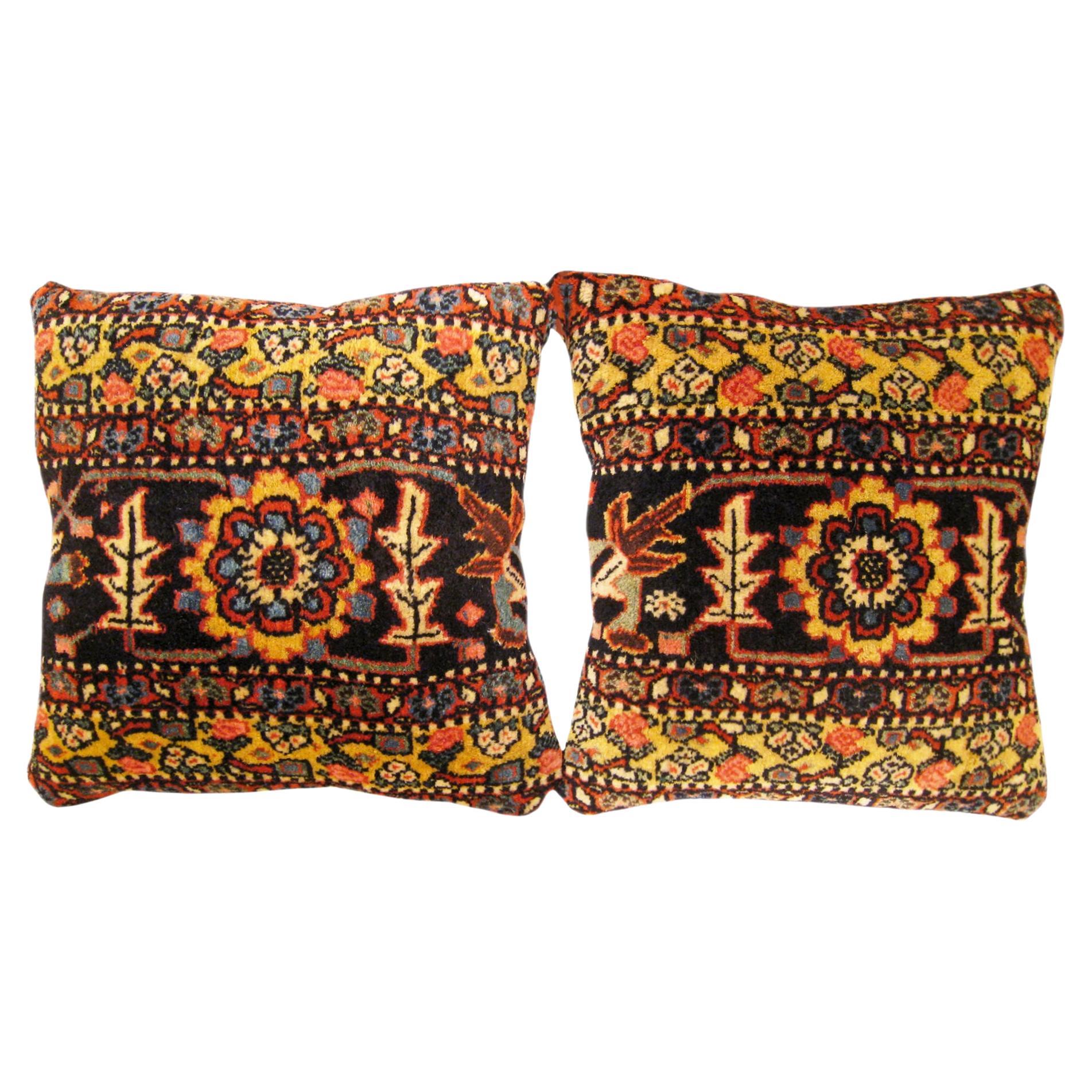 Pair of Decorative Antique Persian Bidjar Carpet Pillows with Floral Elements For Sale