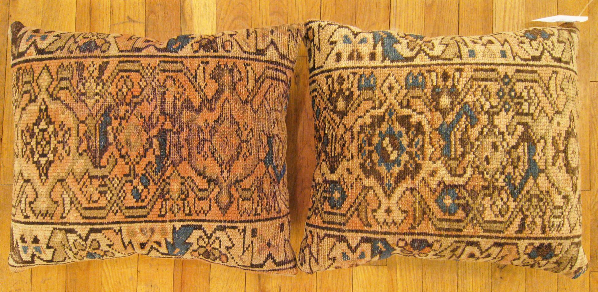 A pair of Antique Persian Hamadan Rug Pillows ; size 1'8” x 1'4” each.

An antique decorative pillows with geometric abstracts allover a light brown central field, size 1'8” x 1'4” each. This lovely decorative pillow features an antique fabric of