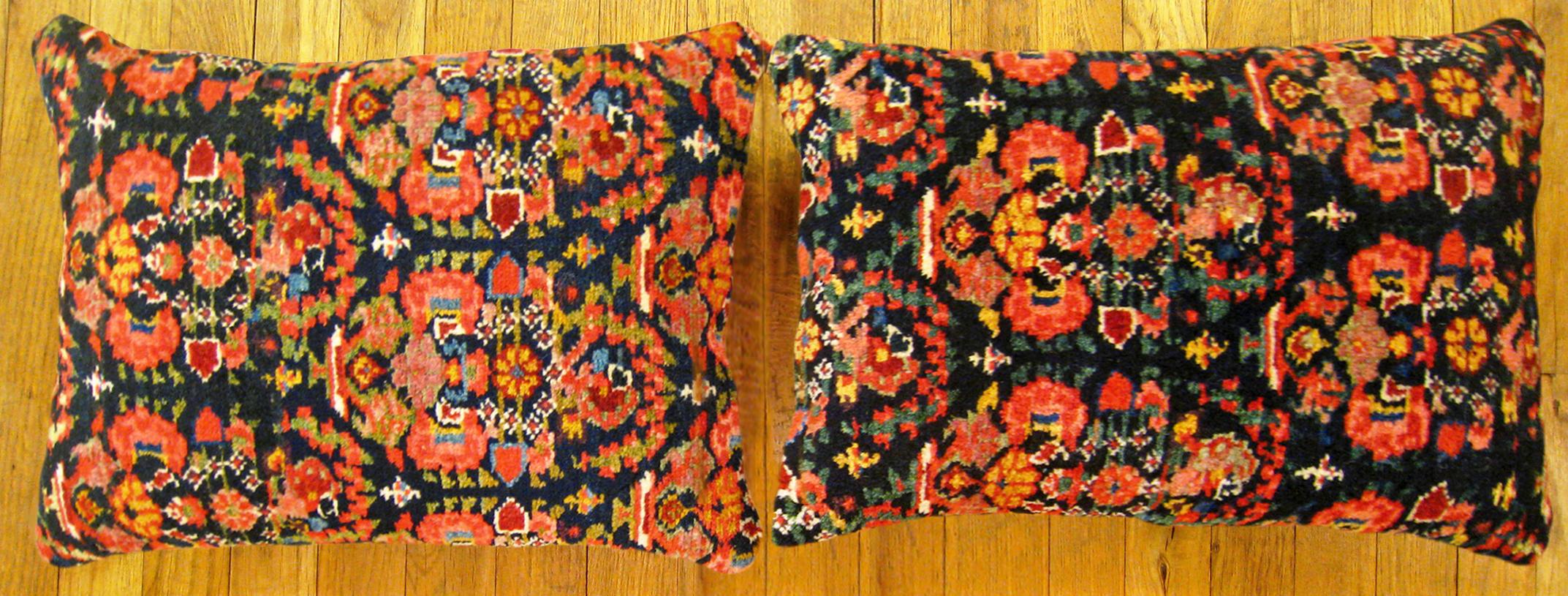 A pair of antique Persian Malayer rug pillows; size 19