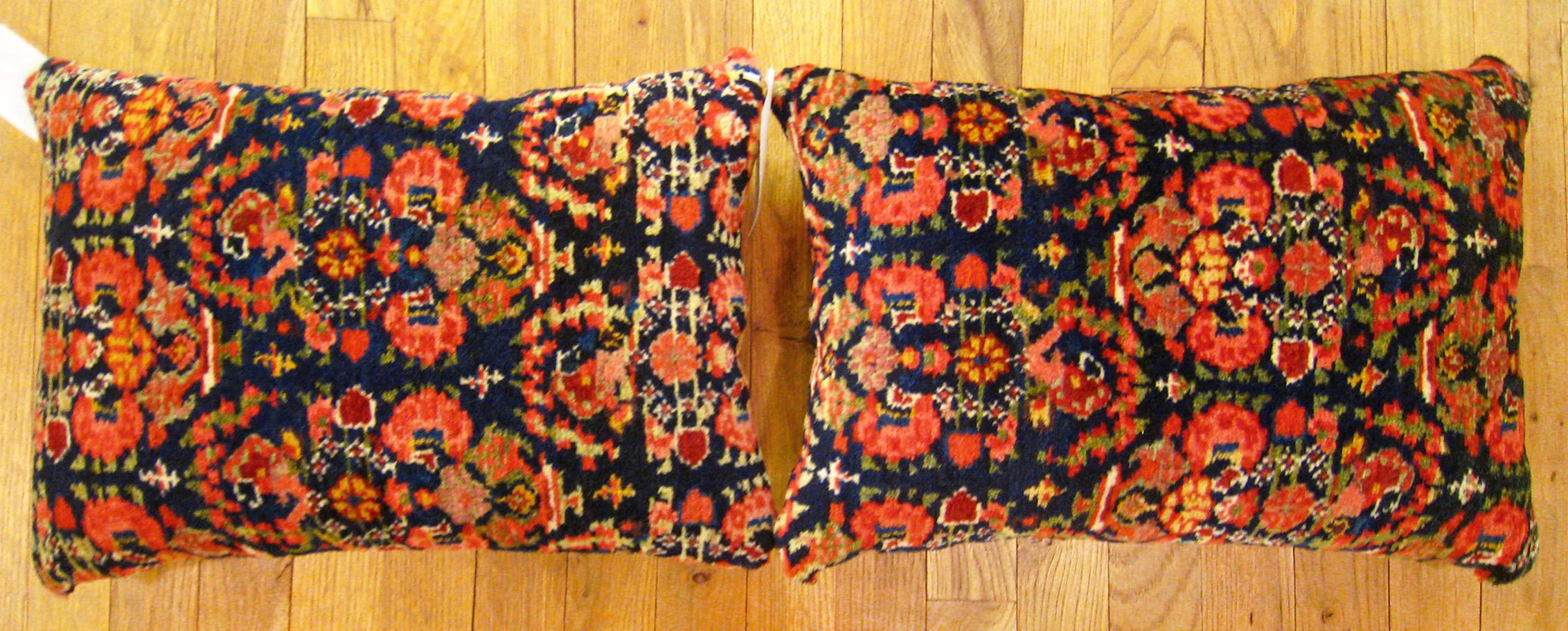 A pair of antique Persian Malayer rug pillows; size 19