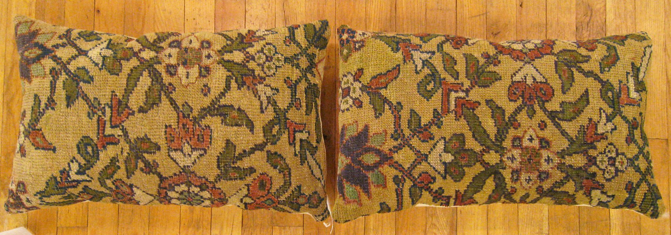 A Pair of Antique Persian Sultanabad Carpet Pillows ; size 2'0” x 1'3” Each.

An antique decorative pillows with floral elements allover a cream central field, size 2'0” x 1'3” each. This lovely decorative pillow features an antique fabric of a