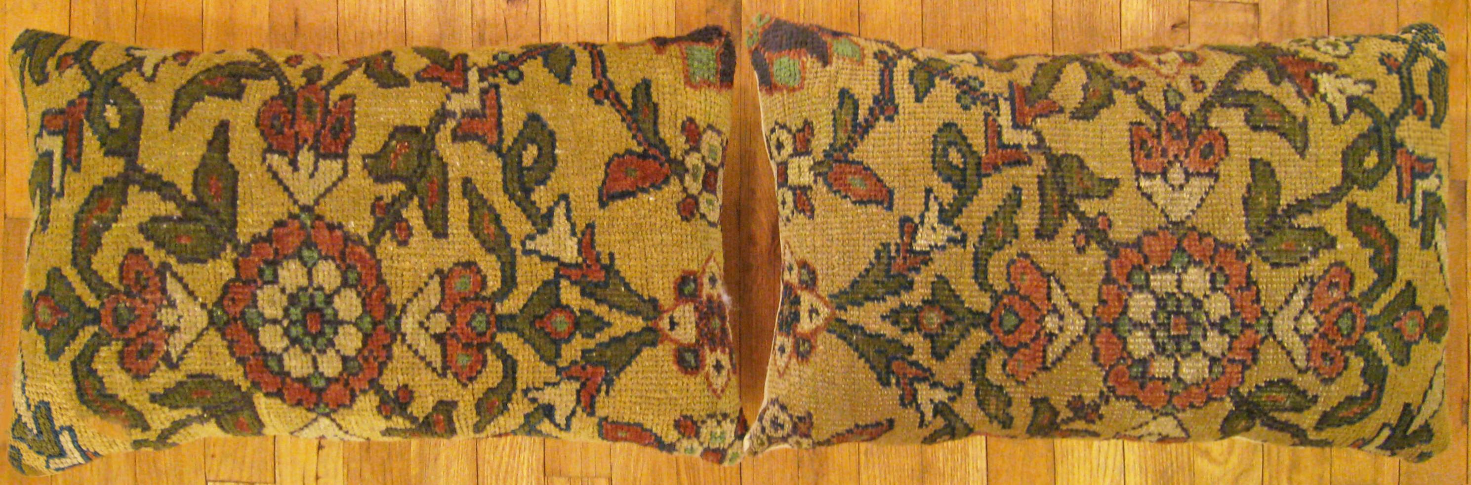 A Pair of Antique Persian Sultanabad carpet pillows ; size 2'0” x 1'3” Each.

An antique decorative pillows with floral elements allover a cream central field, size 2'0” x 1'3” each. This lovely decorative pillow features an antique fabric of a