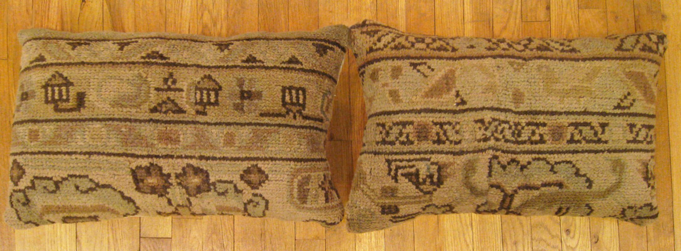 A pair of decorative antique Spanish Savonnerie carpet pillows with geometric design, size 2'0” x 1'3