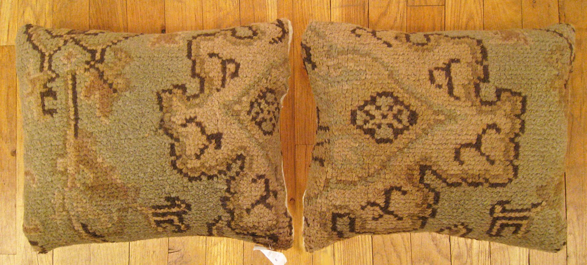A pair of decorative antique Spanish Savonnerie carpet pillows with geometric design, size 1'5