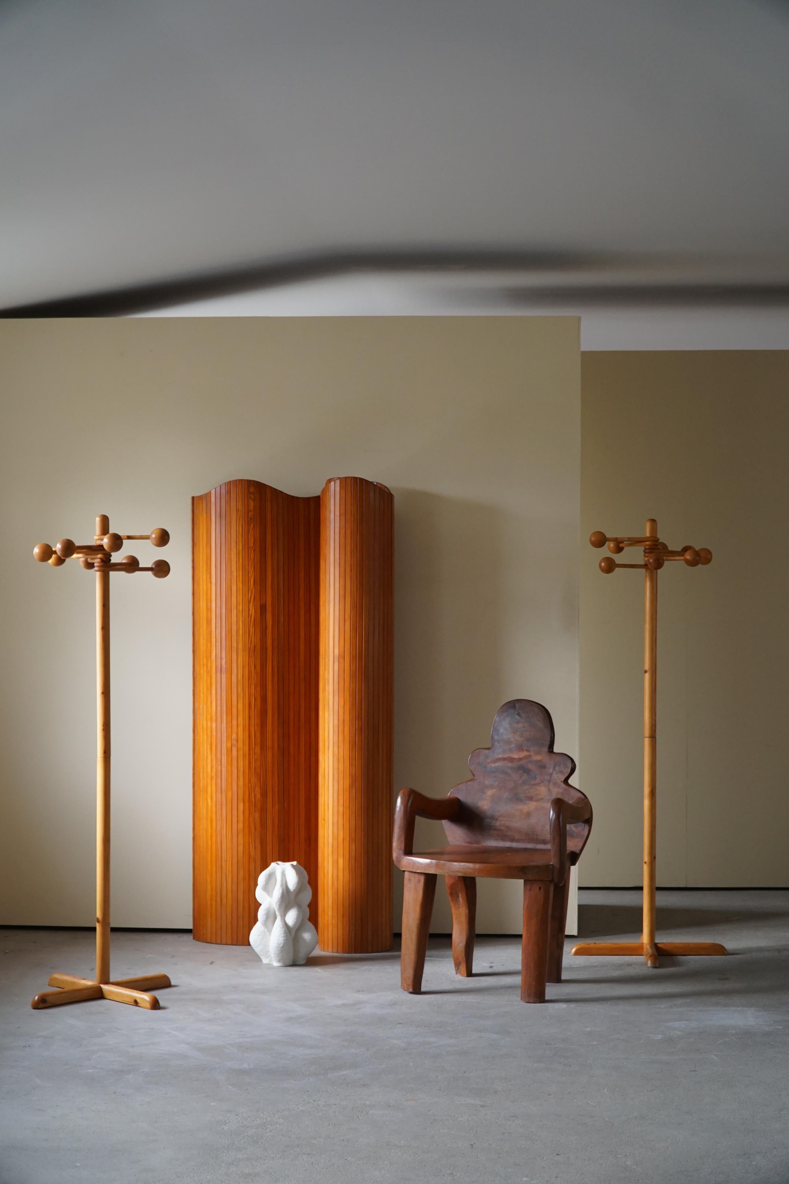 An intriguing pair of sculptural coat stands with 8 adjustable solid chungy globes, all made in solid pine. Crafted by a Danish cabinetmaker in the 1970s. 

This simple and decorative design will complement many types of interior styles. A Modern,