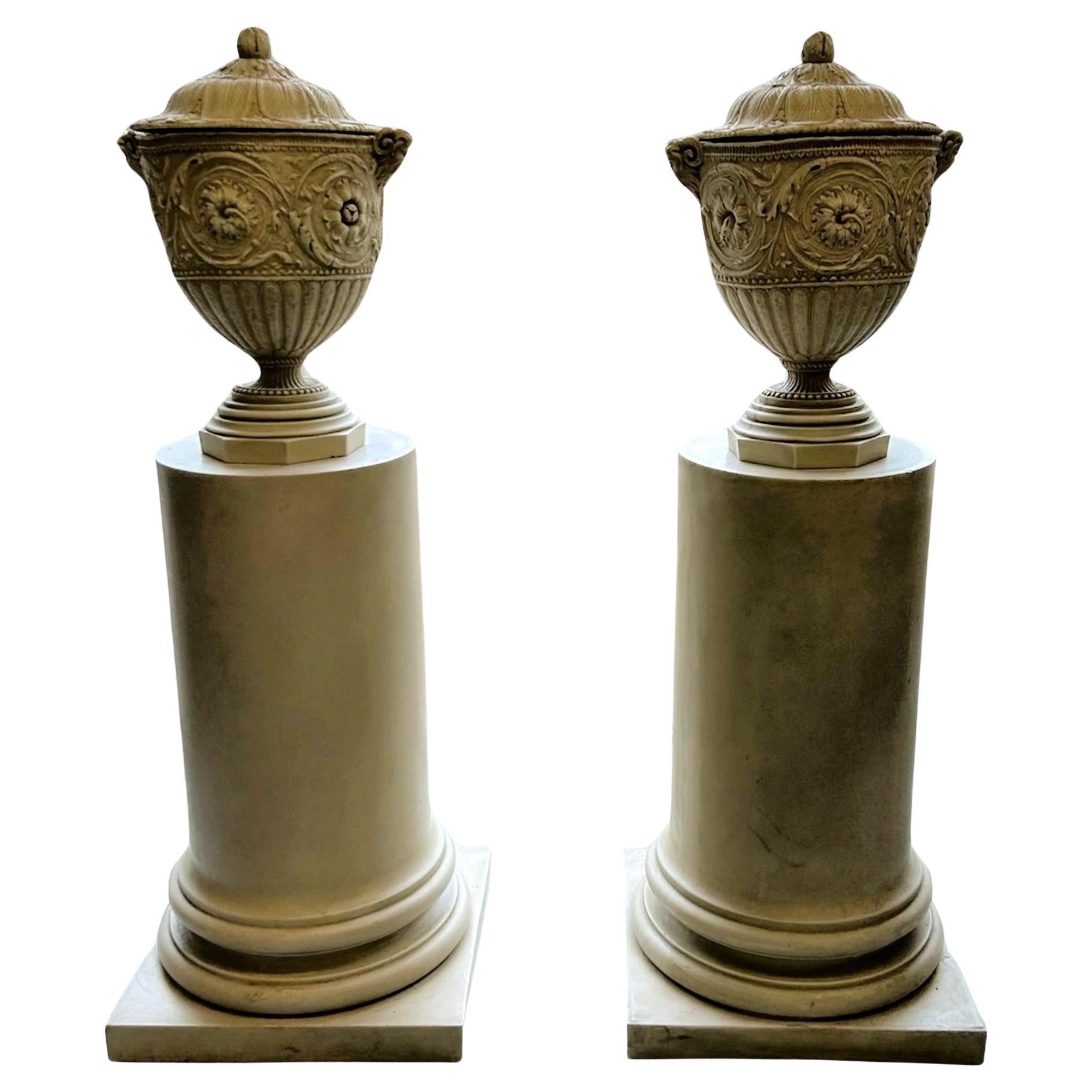 A Pair of Decorative Pedestals with Lidded Urns For Sale