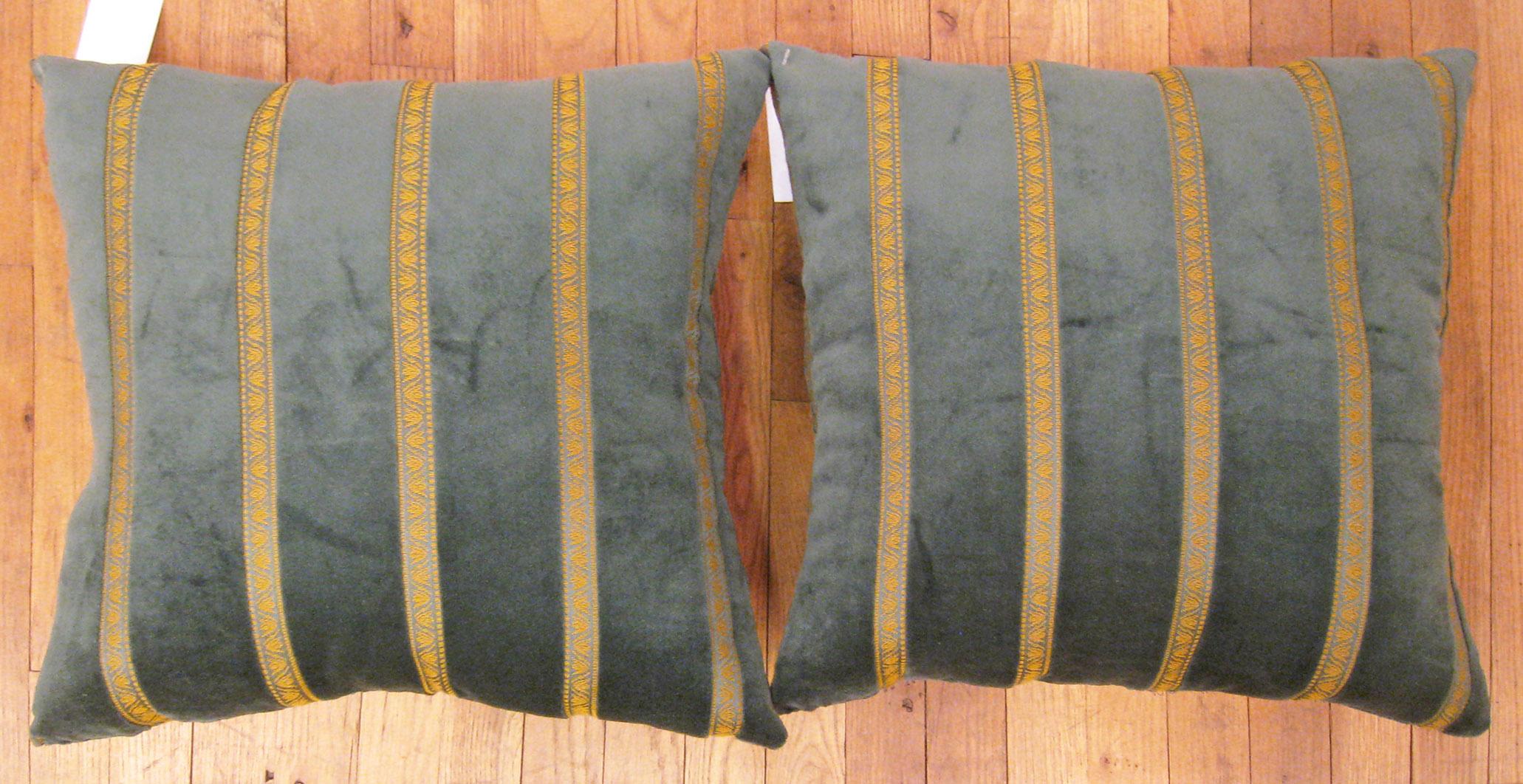 A Pair of Vintage Green velvet American Art deco Pillows ; size 1'8” x 1'8” Each.

A vintage decorative pillows with golden stripes in a black central field, size 1'8” x 1'8” each. This lovely decorative pillow features a vintage fabric of a