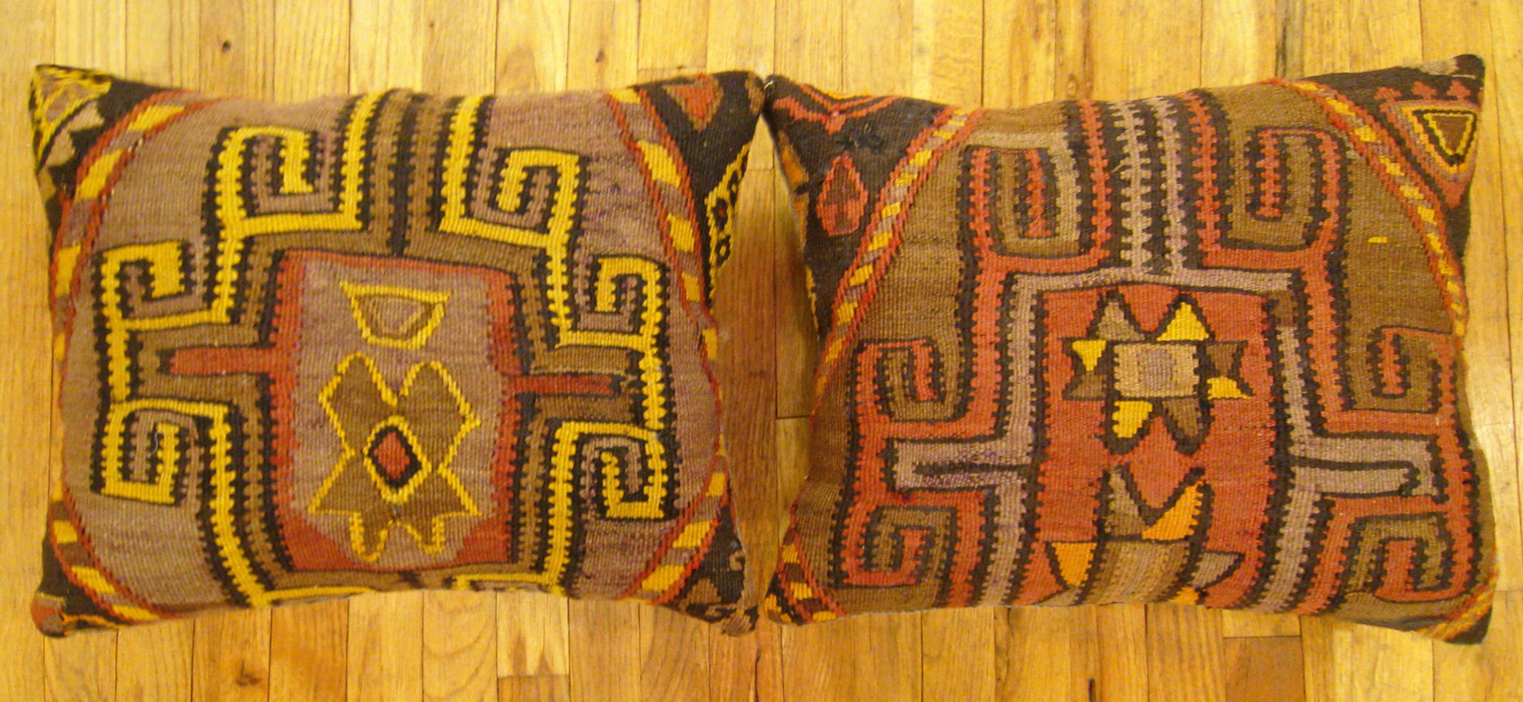 A pair of Vintage Turkish Kilim Rug Pillows; size 22” x 18” each.

A vintage decorative pillows with geometric abstracts allover a brown central field, size 22” x 18” each. This lovely decorative pillow features a vintage fabric of a KIilim carpet