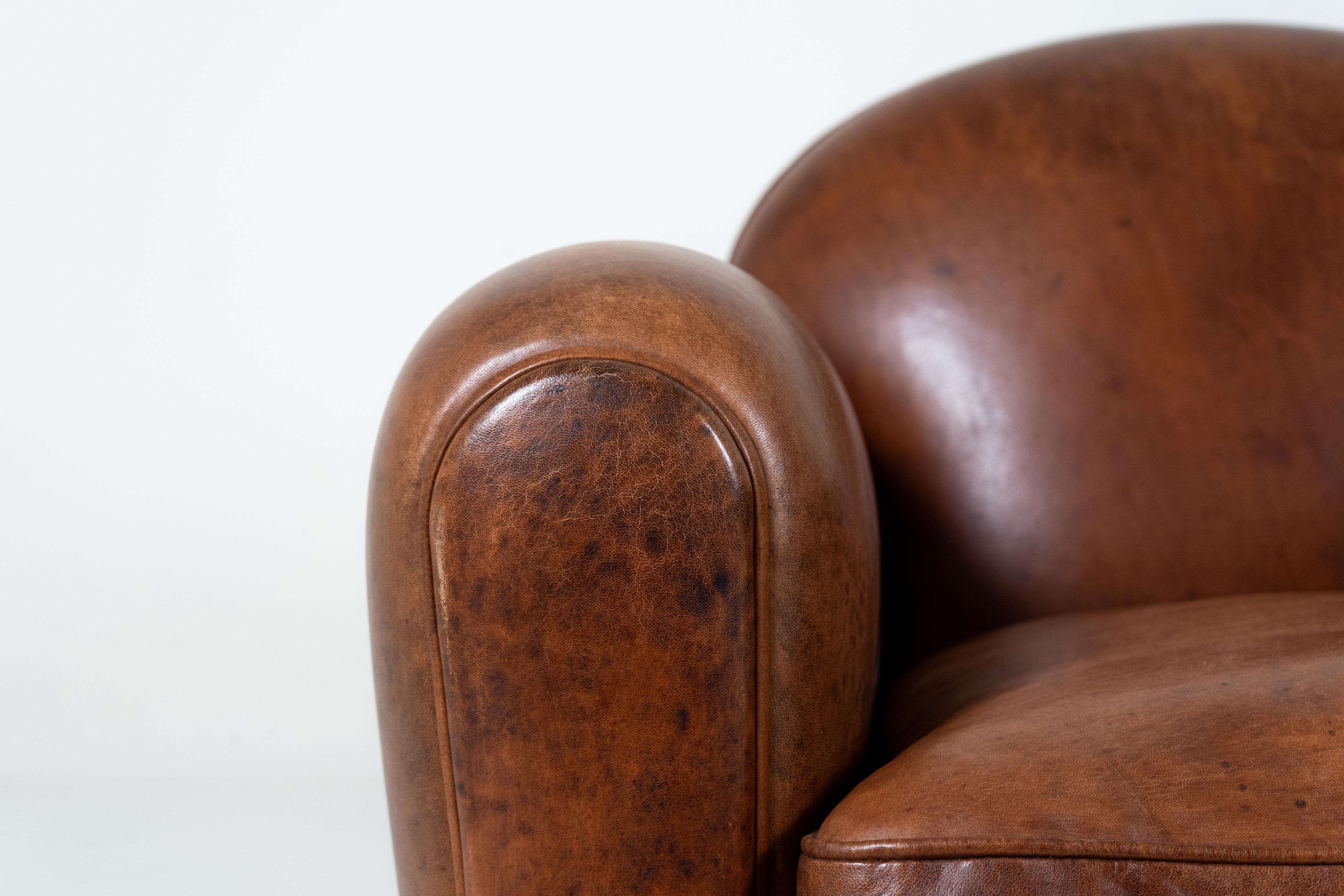 A Pair of Demi Lune French Club Chairs in Patinated Leather For Sale 5