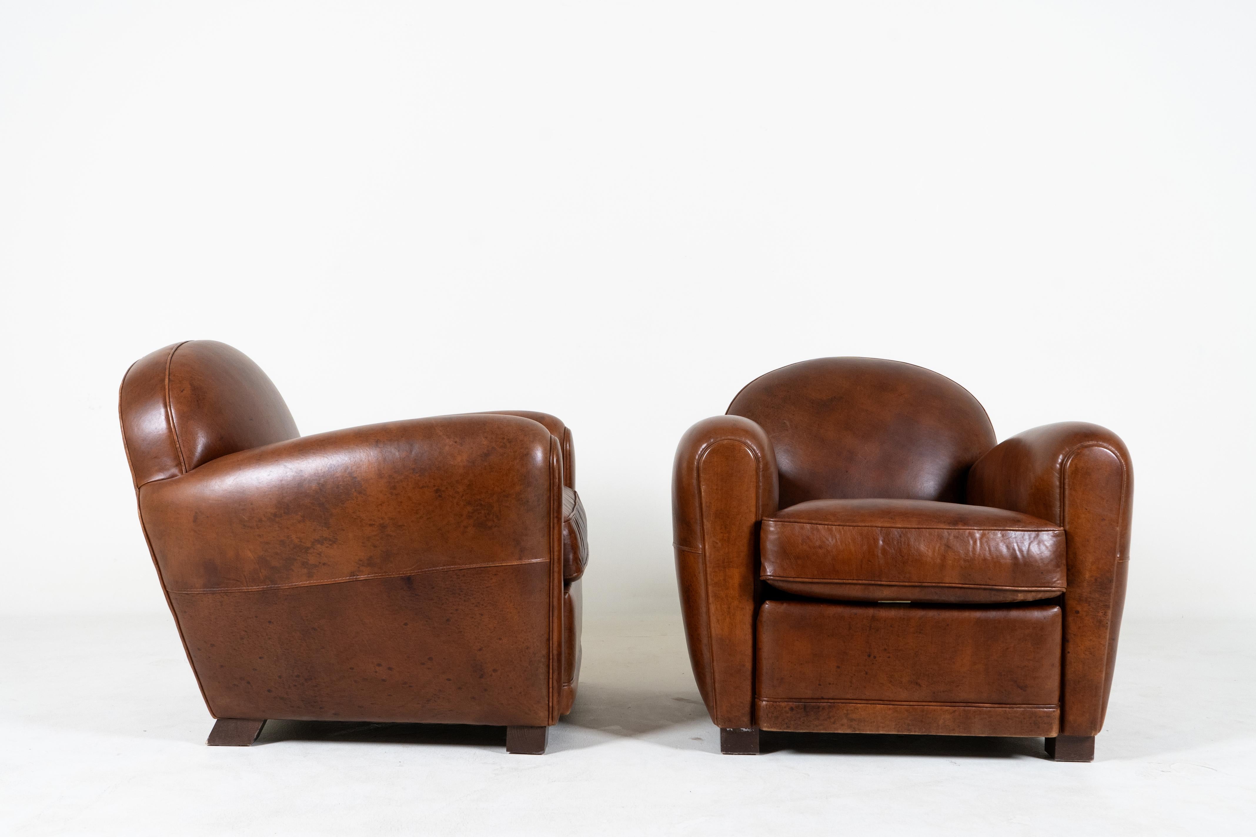 Contemporary A Pair of Demi Lune French Club Chairs in Patinated Leather For Sale