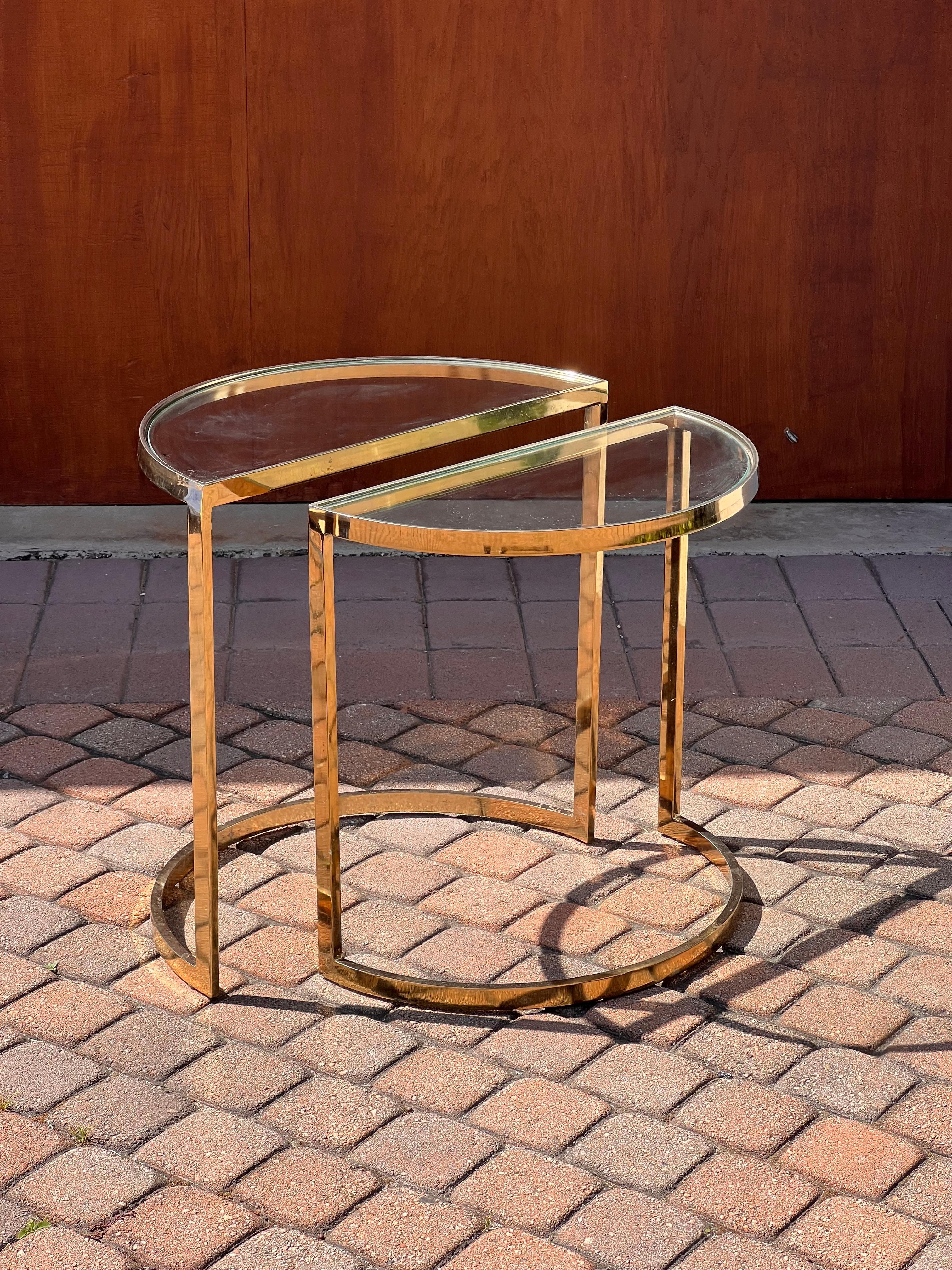 A handsome pair of demi-lune side or end tables with brass frames and glass inserts, circa late 1970s. These are possibly attributed to Milo Baughman; there is no maker’s mark, but they came from the estate of an avid Baughman collector. One table
