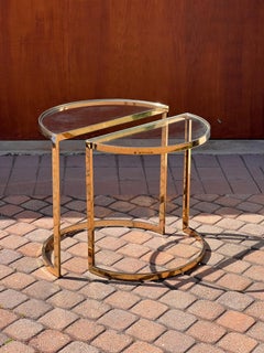 A pair of demi-lune gilt end tables, 1970s