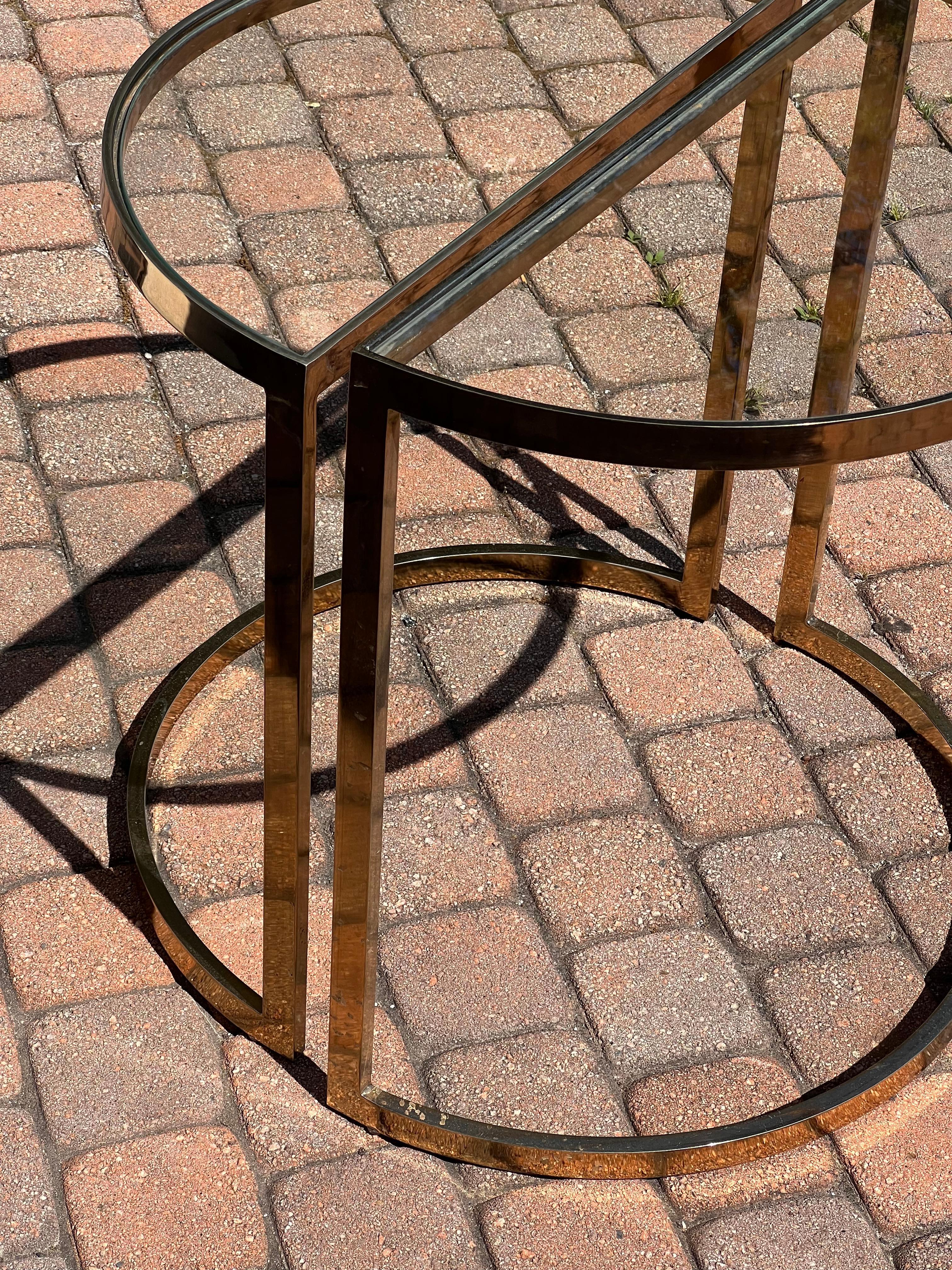 Brass A pair of demi-lune gilt end tables, 1970s For Sale