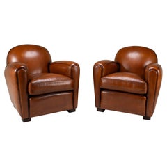 A Pair of Demi Lune Sheepskin Chairs