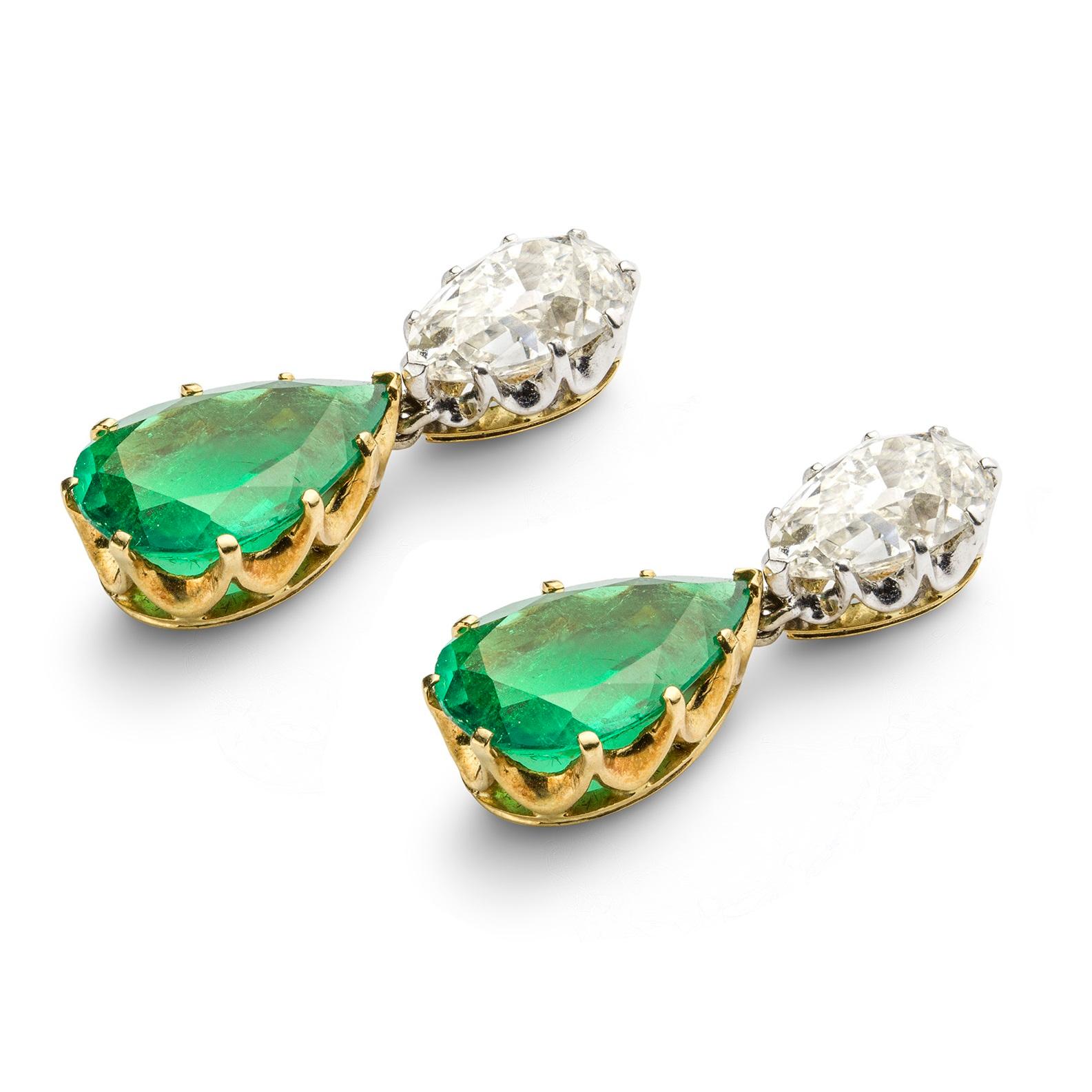 A pair of vintage diamond and emerald drop earrings, each set with a pear-shaped Colombian emerald weighing 7.26 carats for the pair, suspended from a pear-shaped diamond top weighing 1.97 carats H colour and SI2 clarity and 2.09 carats I colour and