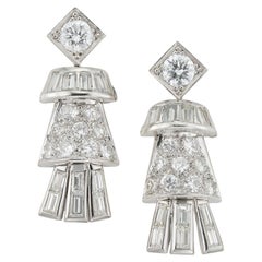 A pair of diamond drop earrings