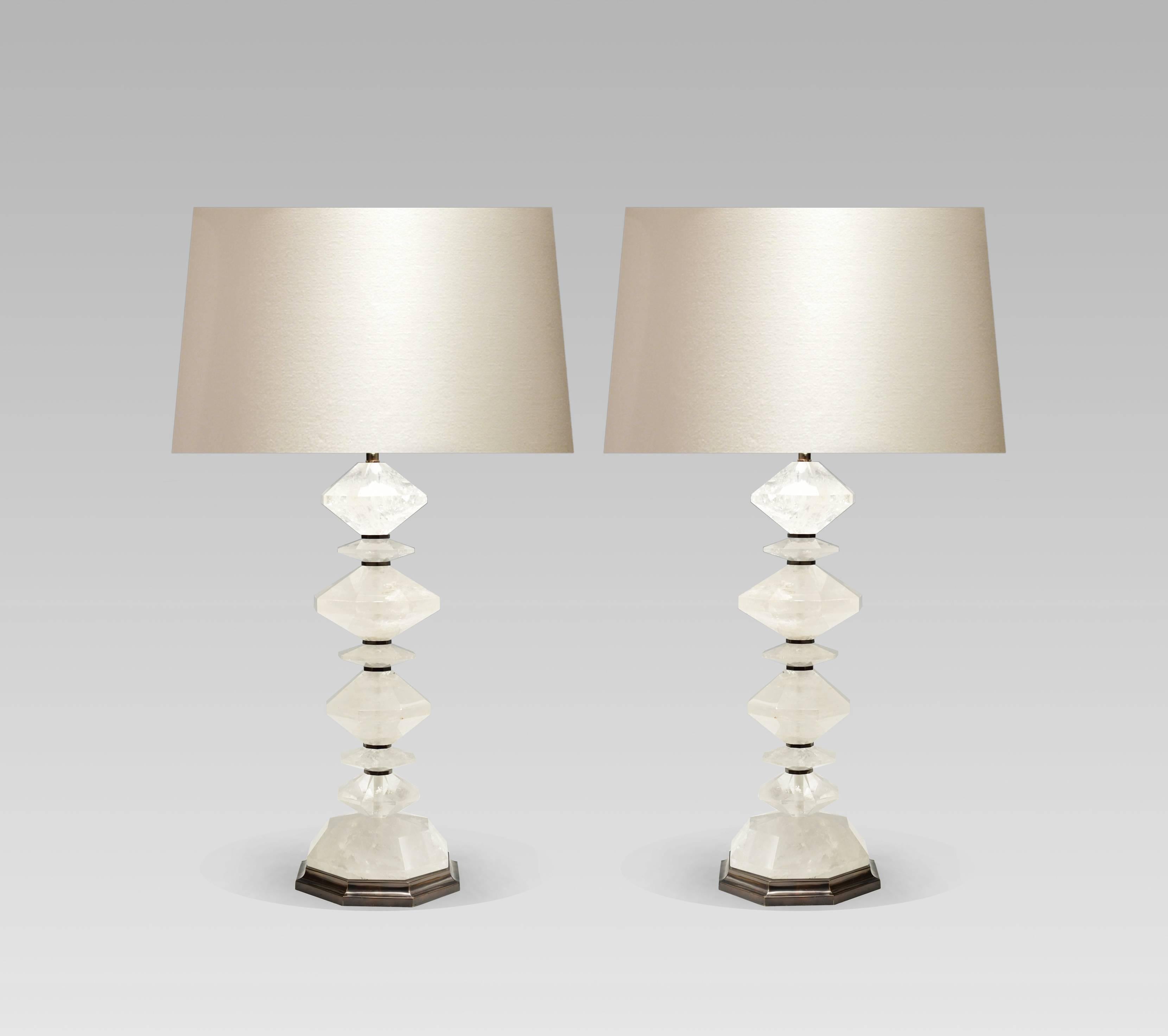 A pair of diamond form rock crystal table lamps, by Phoenix Gallery
The height to the top of the rock crystal is 21 height
The height with shades is 35 height.
