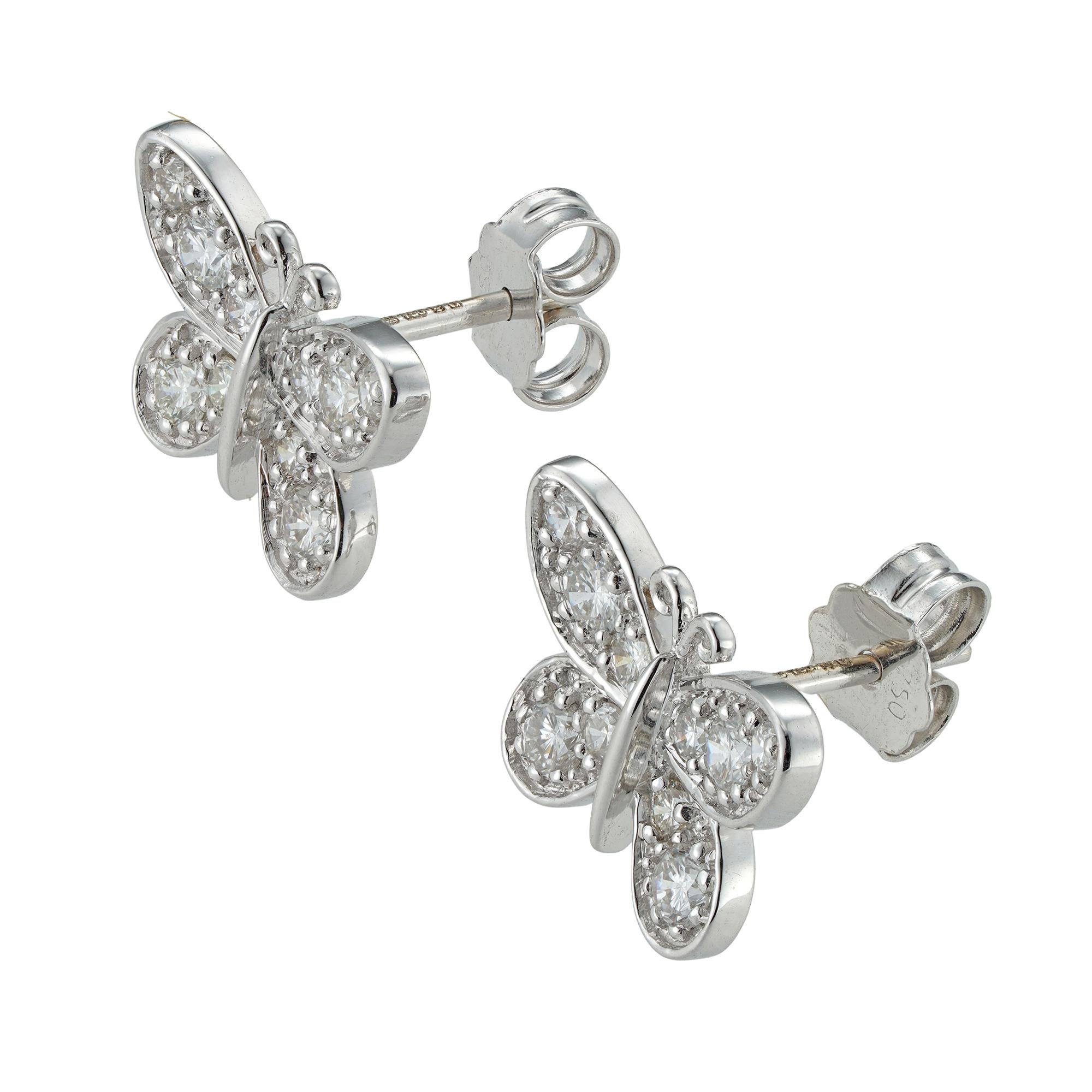 A pair of diamond-set butterfly earrings, the wings of each butterfly grain-set with ten round brilliant-cut diamonds, all diamonds weighing 0.7 carats in total, mounted in 18ct white gold mount with post and scroll fittings, hallmarked 18ct gold